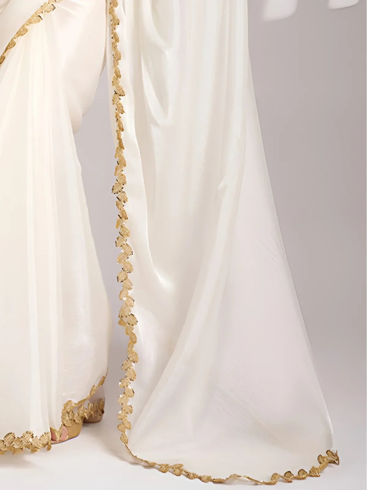Tarani white saree pallu view with delicate sequin codding lace border