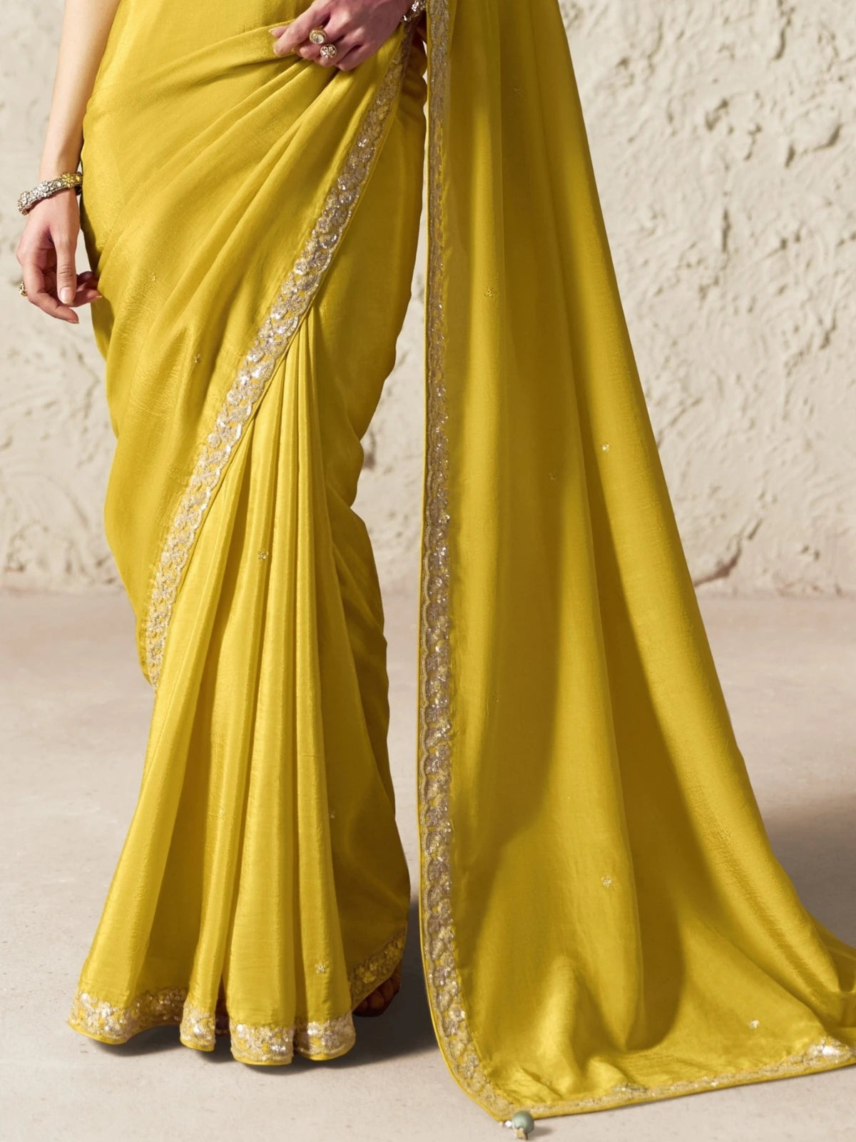Tarani yellow organza saree pallu view with sequins butti work and detailed embroidery border