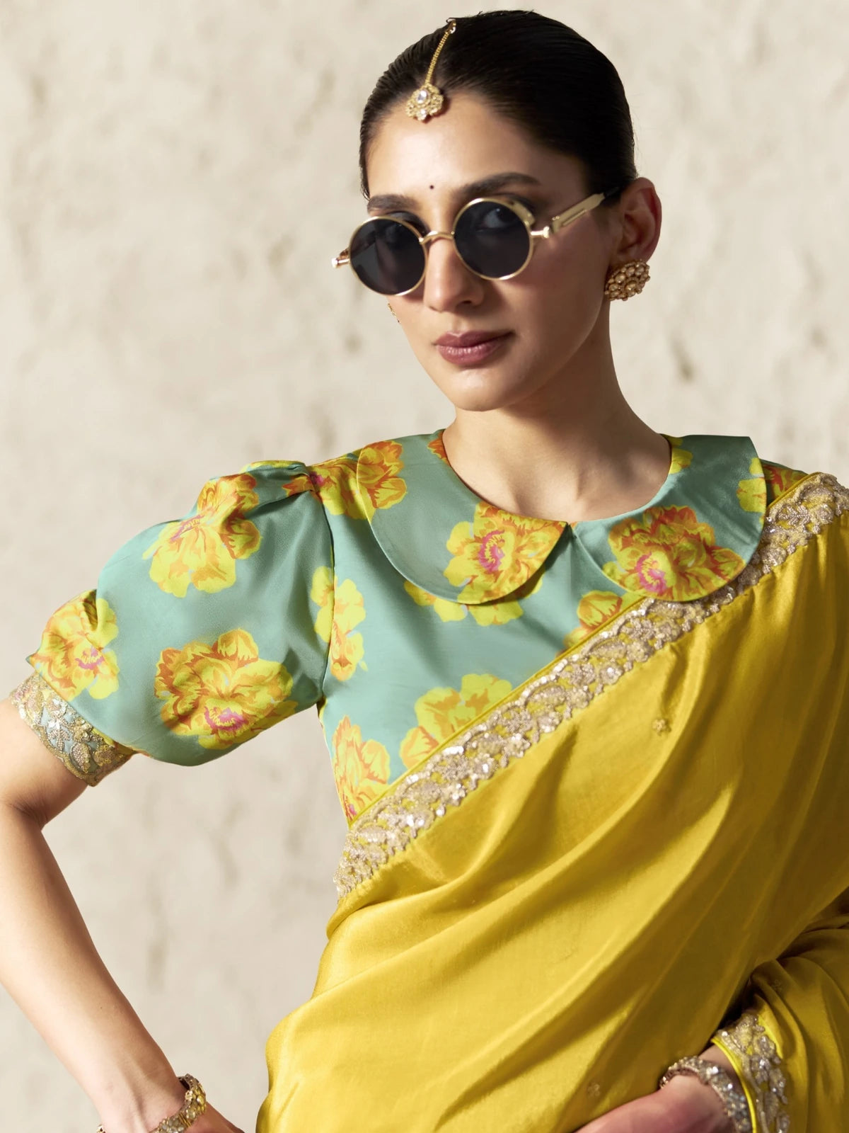 Tarani yellow organza saree upper body view with floral blouse and embroidered lace border