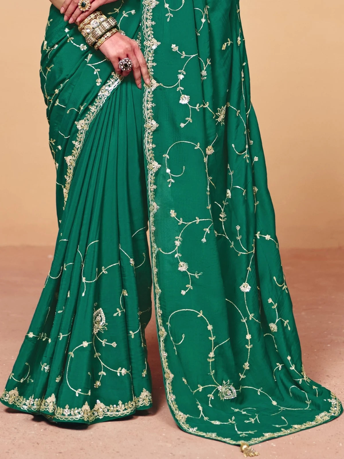 Tarani green organza satin saree closeup with sequince heavy embroidery border detailing