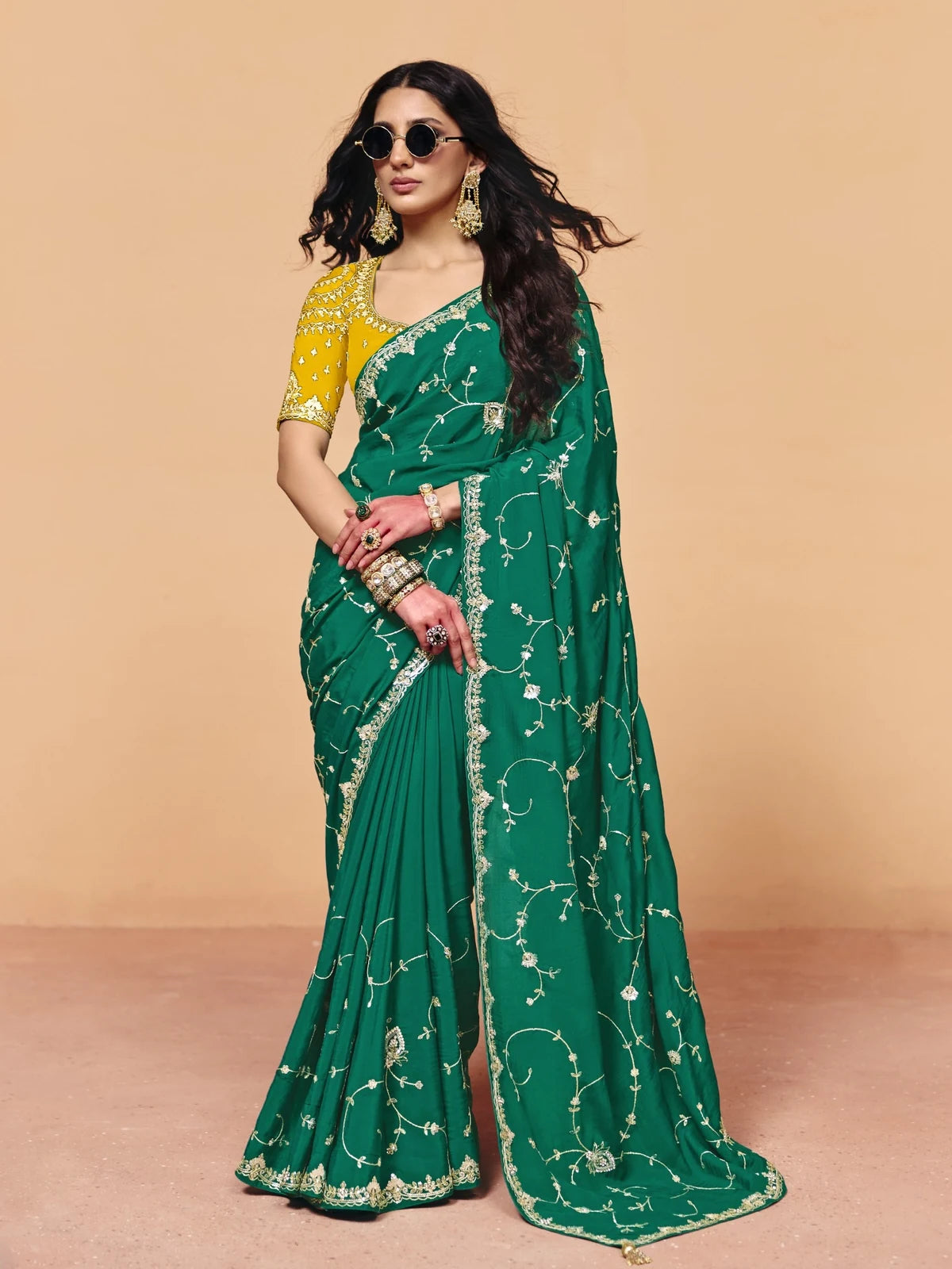 Tarani green organza satin saree with sequince embroidery for festive and party wear