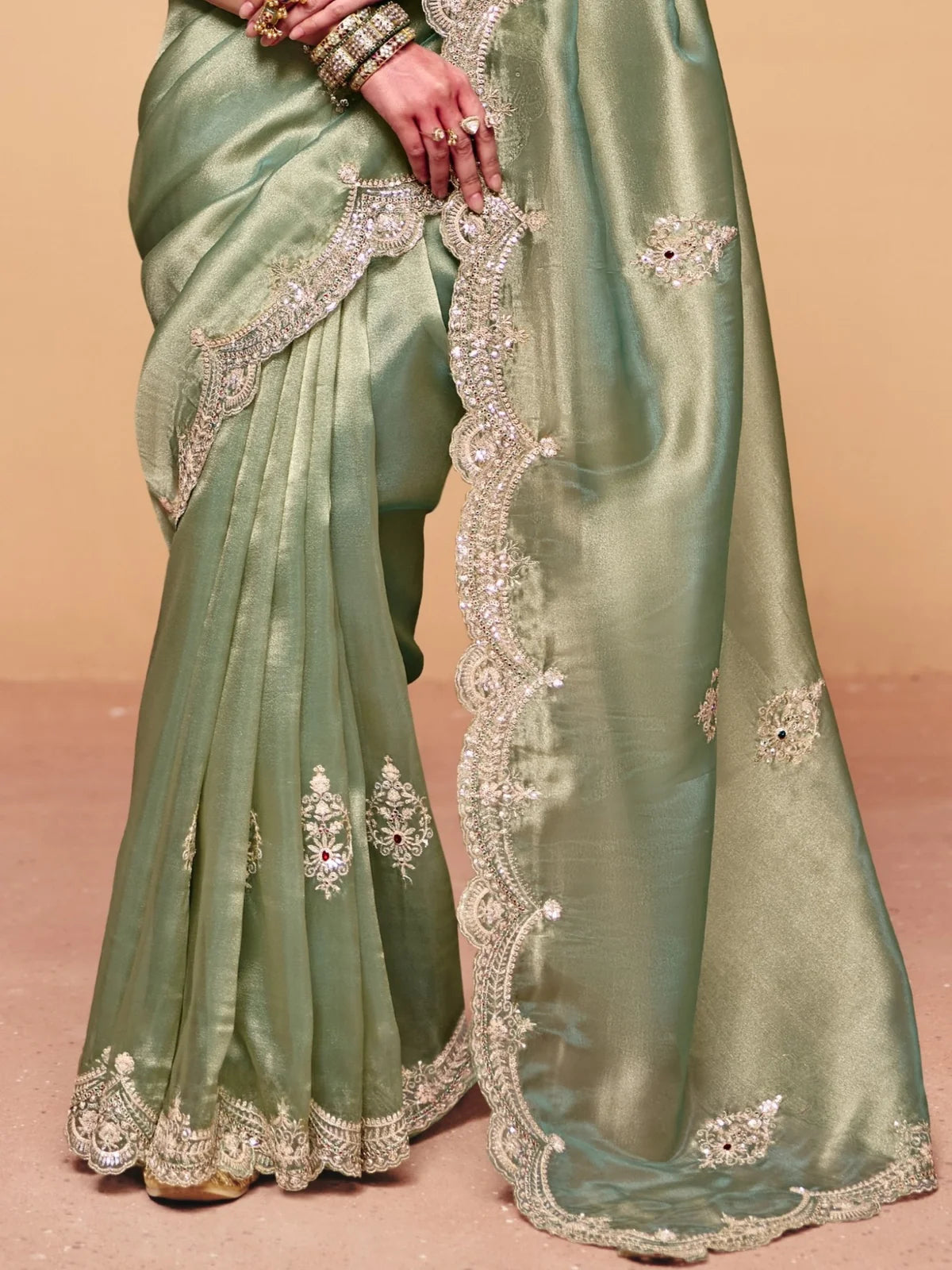 Tarani green organza satin saree pallu view with heavy embroidered border detailing