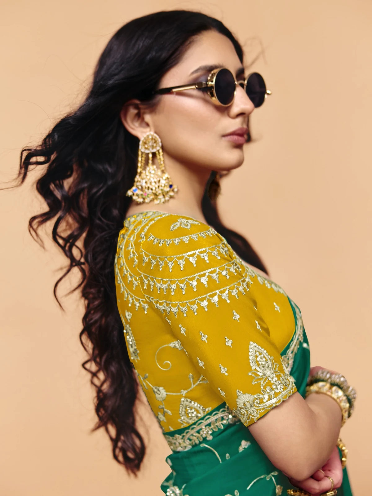 Tarani green saree blouse side view with sequince embroidery work and designer detailing