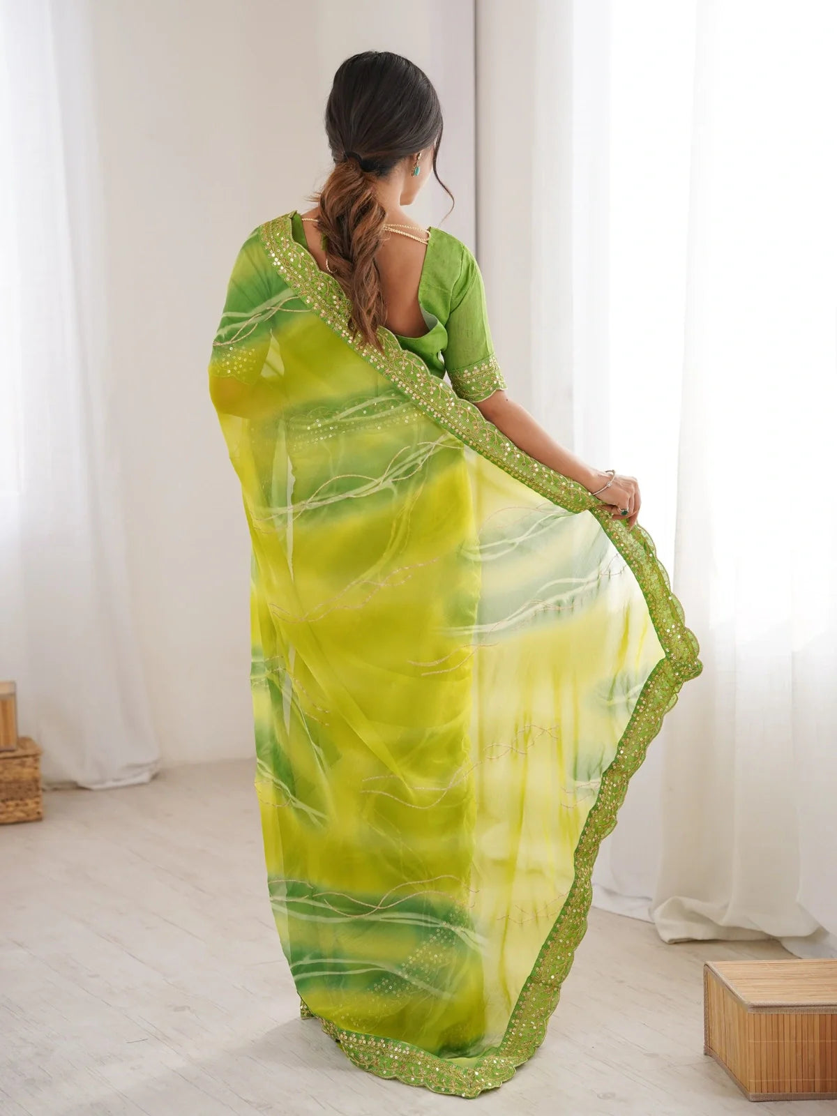 Tarani green saree full back view highlighting border and fall