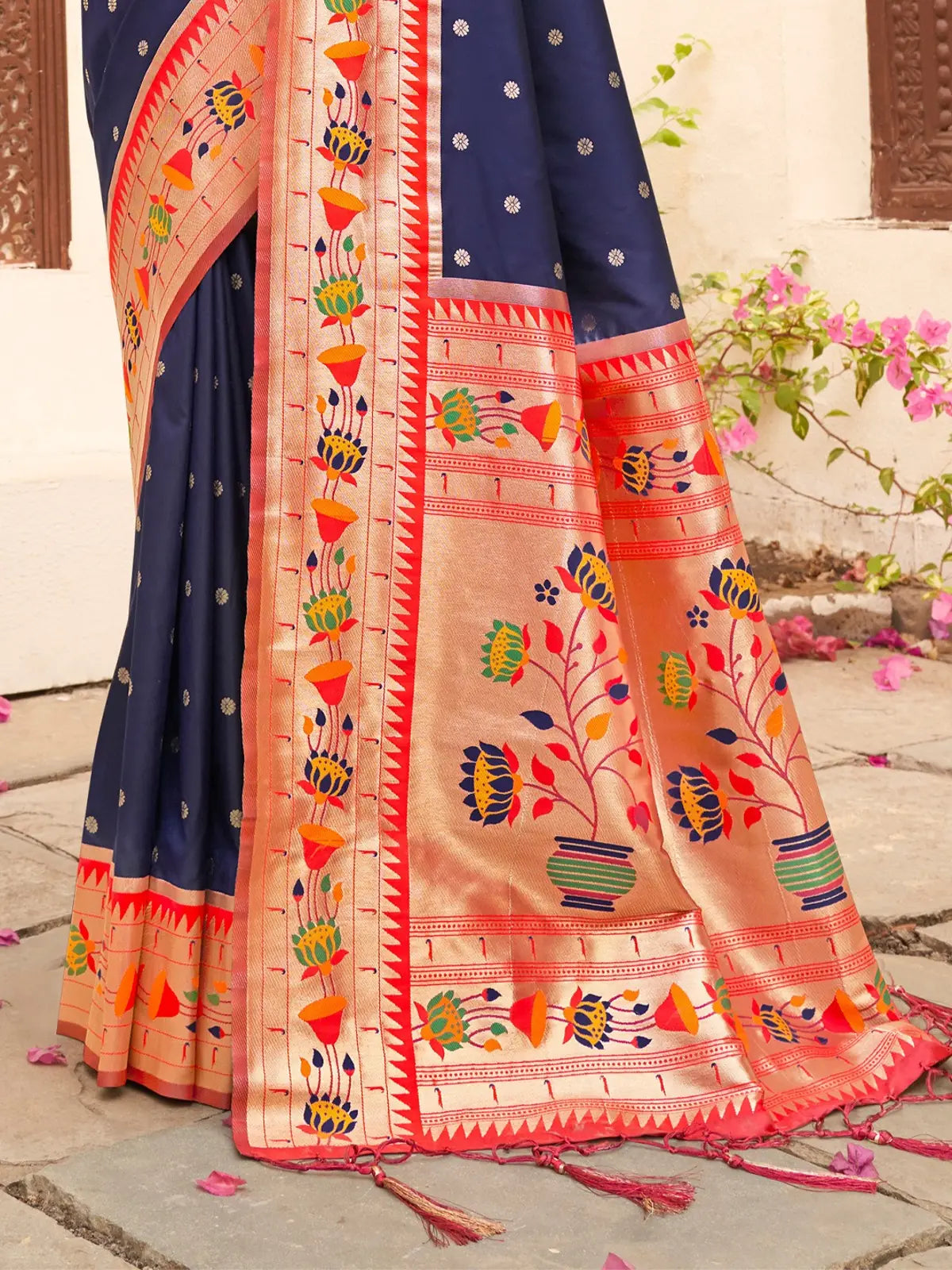 Tarani navy blue Paithani silk saree pallu view highlighting zari weaving and floral motifs