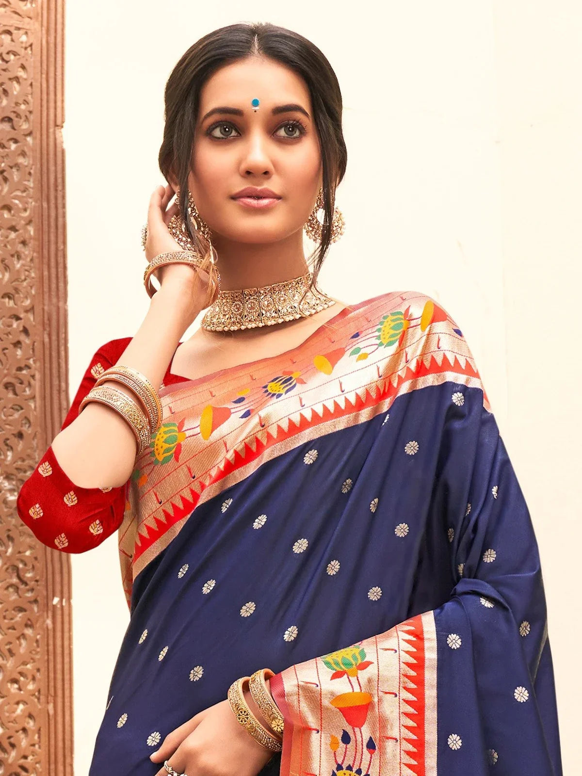 Tarani navy blue Paithani silk saree upper body view with elegant zari border and blouse piece