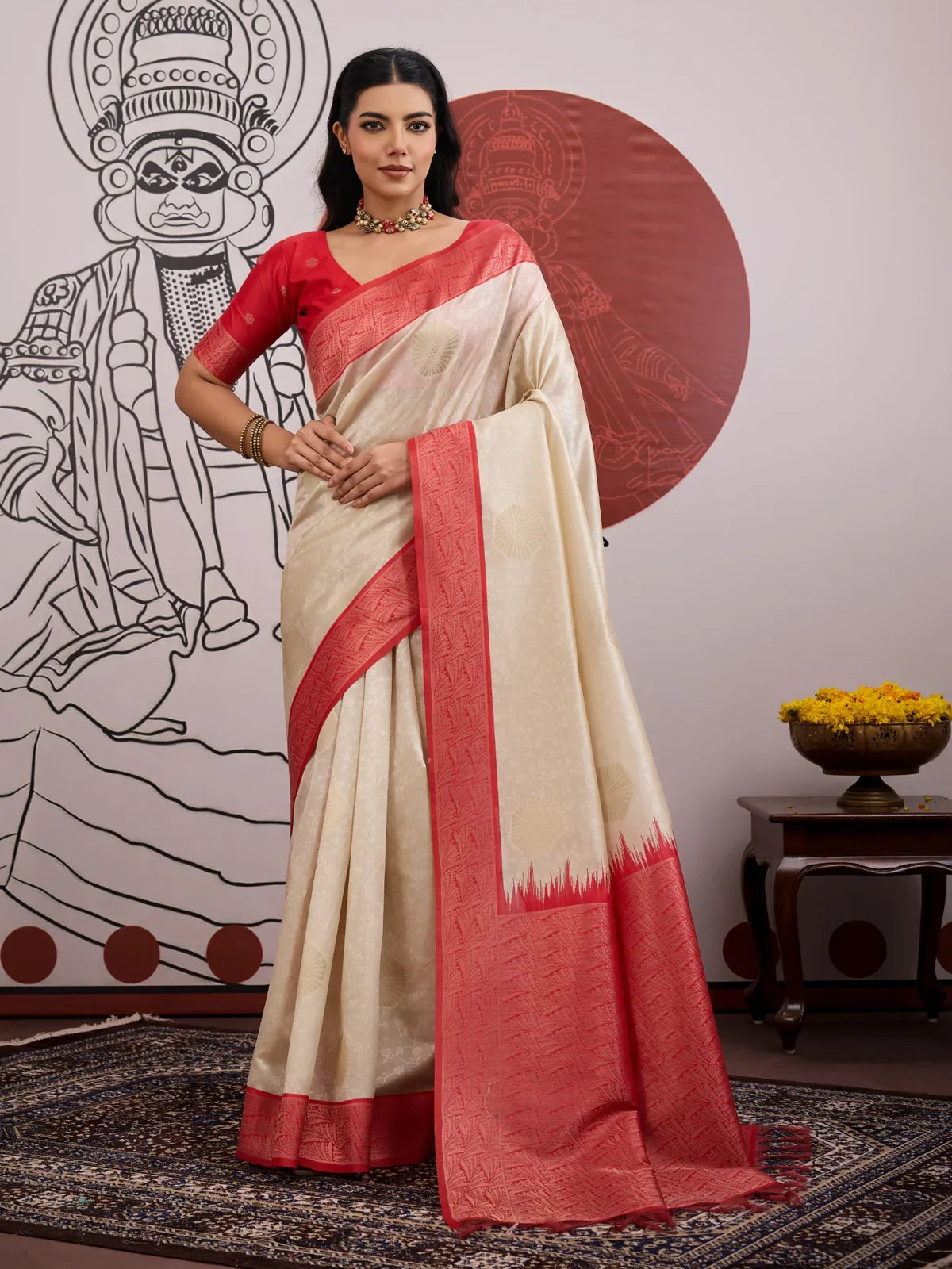 Tarani beige paper silk saree with red border and elegant pallu shown in full drape view