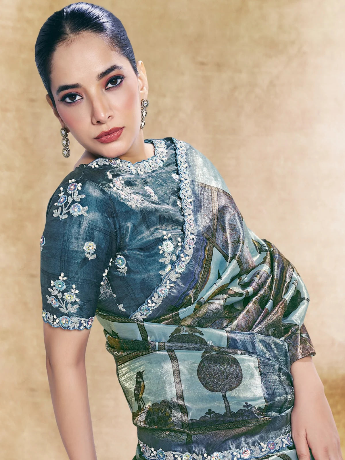 Tarani blue paper silk saree upper body view showing embroidered blouse and traditional print Pakhi