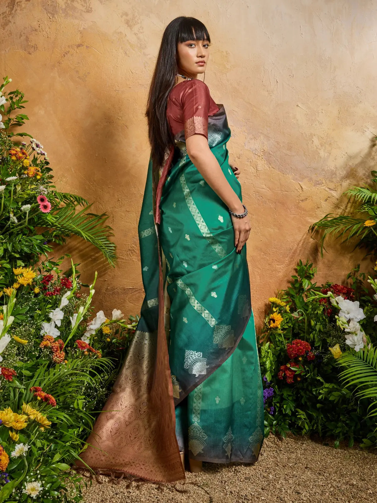 Tarani back view of green paper silk saree showcasing elegant pallu and blouse