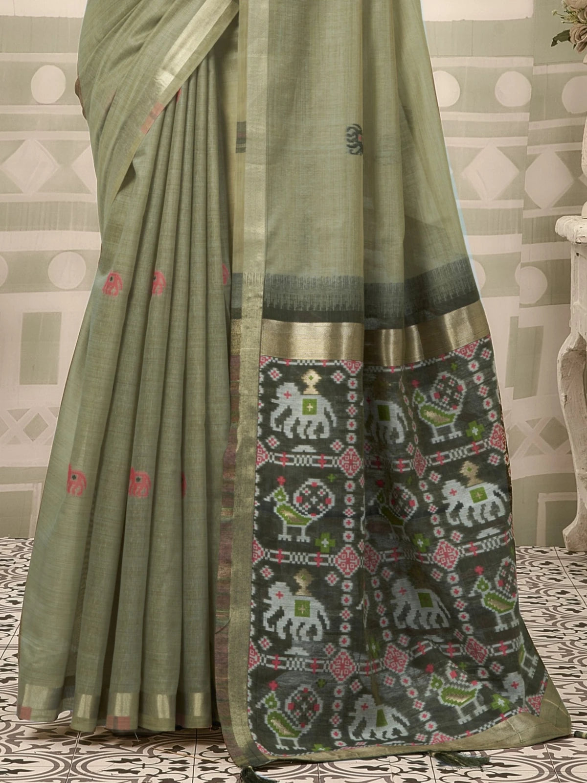 Tarani green patola saree with zari border and fancy tassels pallu-view