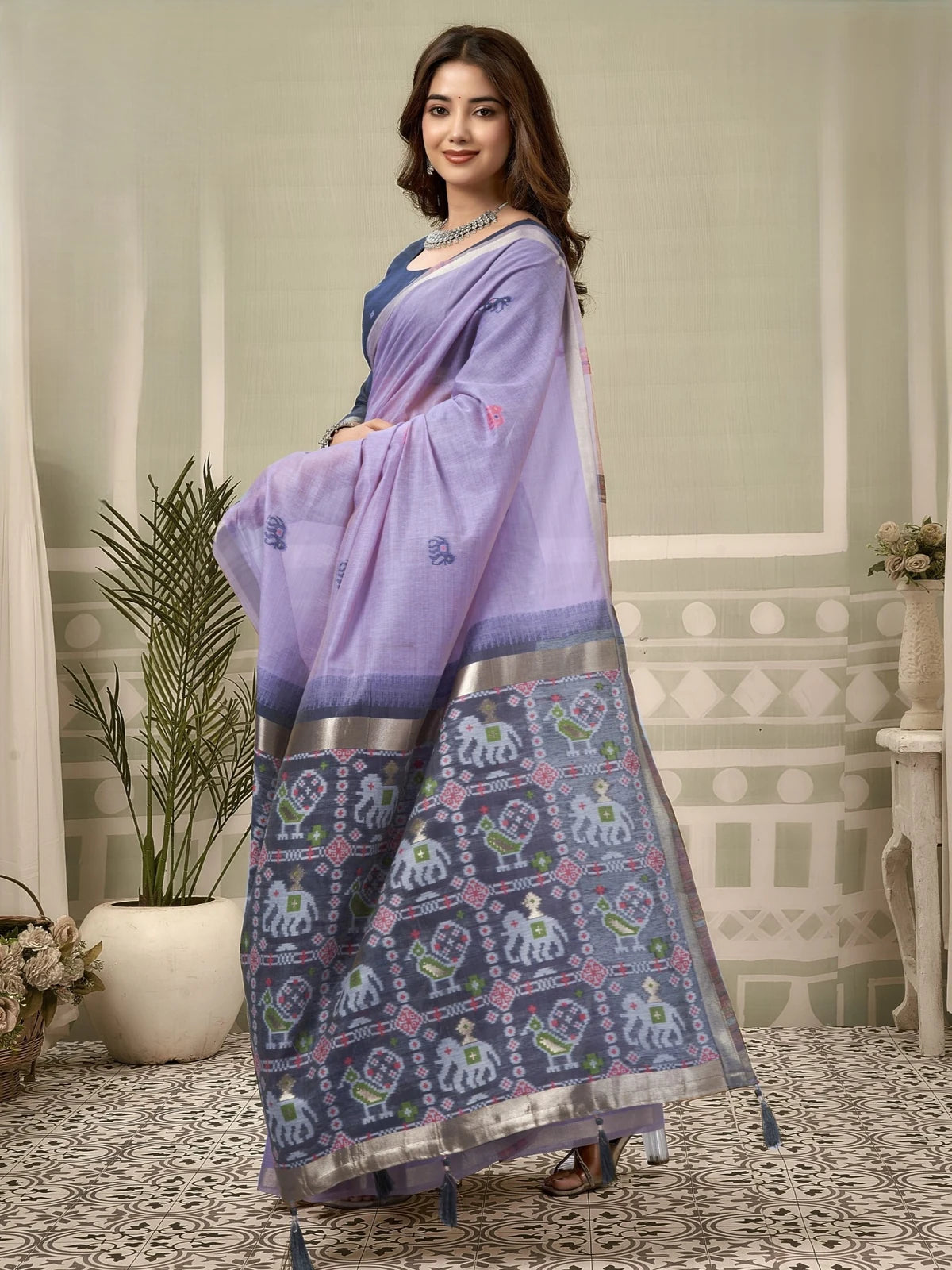 Tarani lavender Patola saree side view highlighting woven zari border patola pallu and tassels