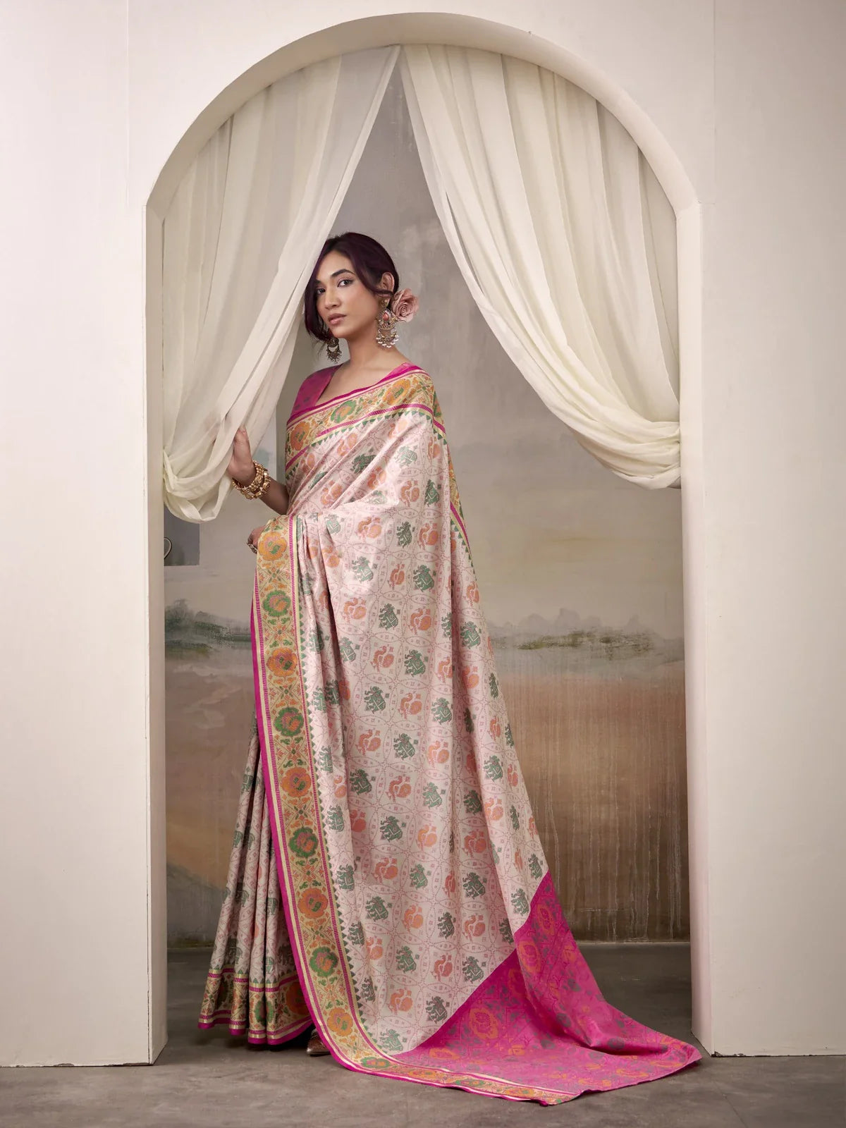 Tarani pink patola silk saree closeup view highlighting woven detailing and border