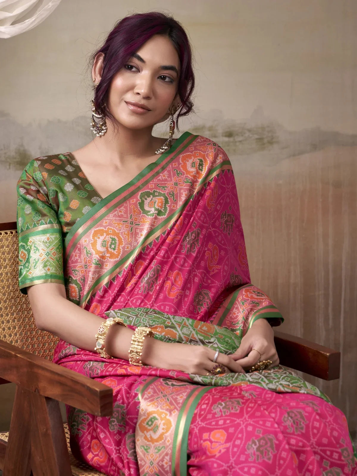 Tarani pink patola silk saree close view with woven blouse upper body style