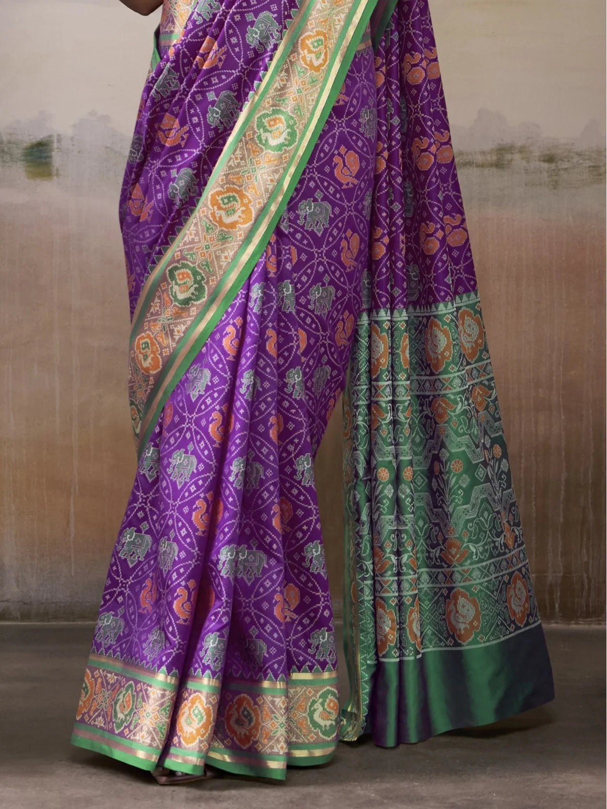 Tarani Patola silk saree pallu view with rich green border and traditional design