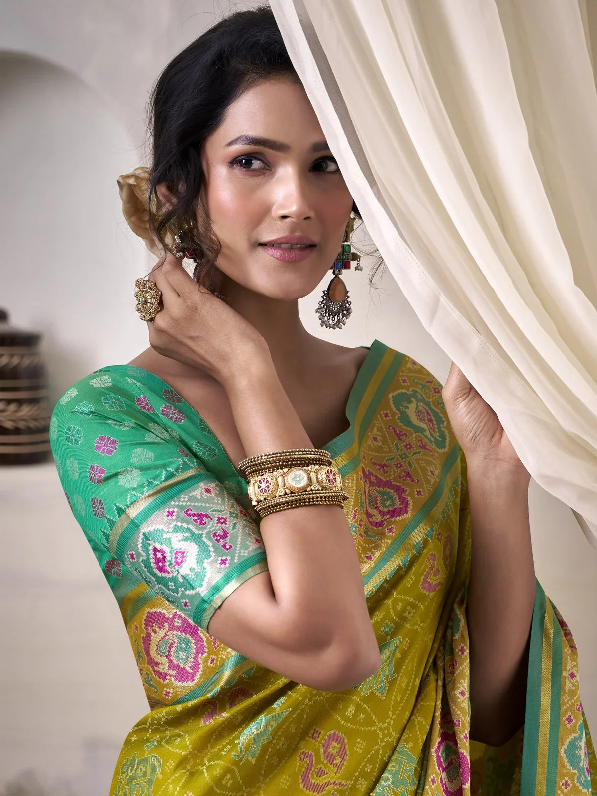 Tarani yellow patola silk saree closeup of woven dual tone blouse design