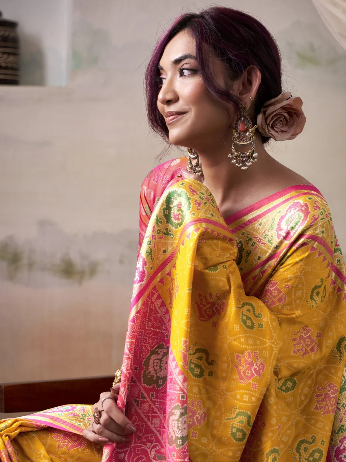 Tarani patola silk yellow saree upper body close shot showing blouse design and woven border