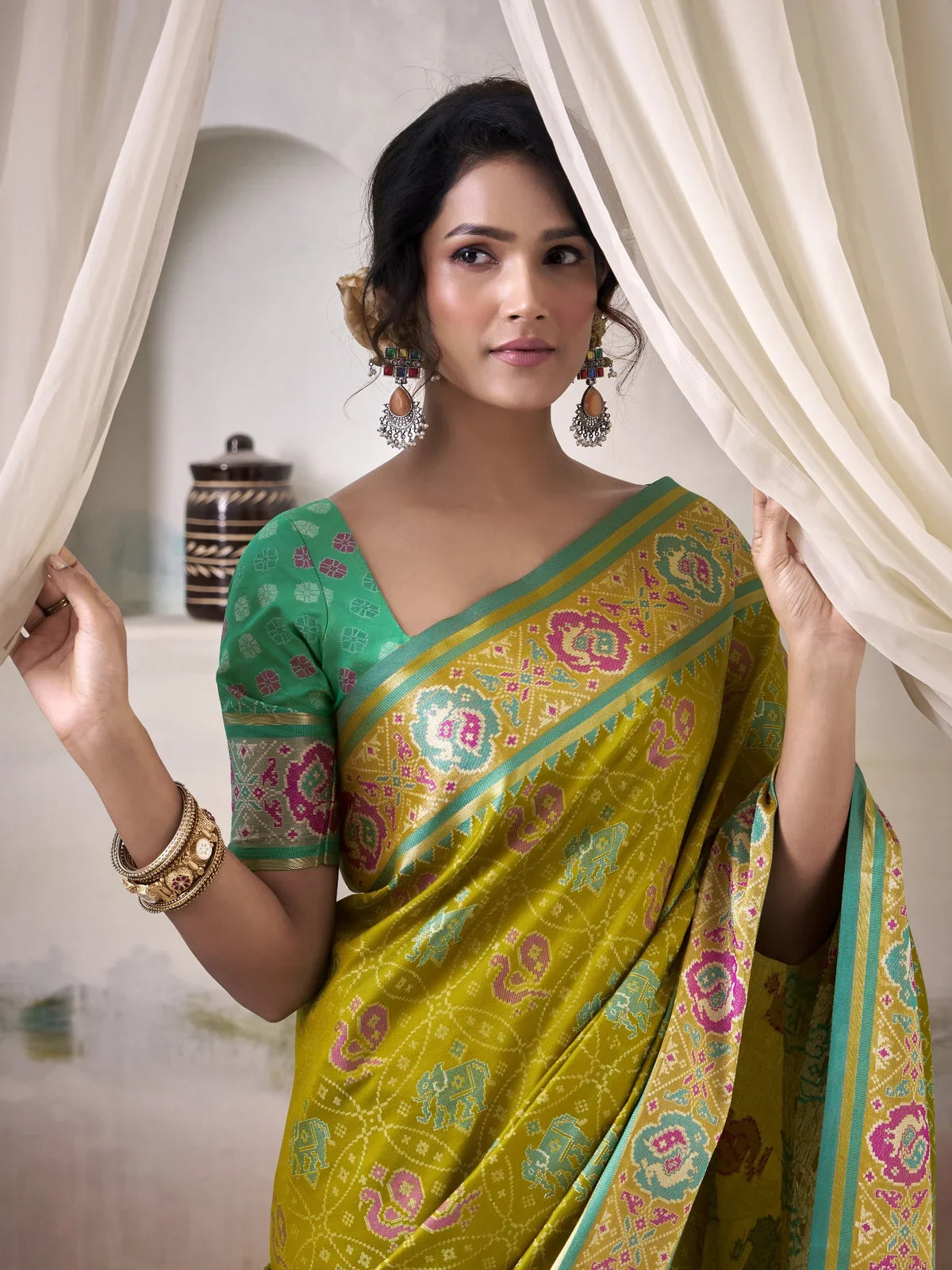 Tarani yellow patola silk saree upper body view highlighting blouse and drape