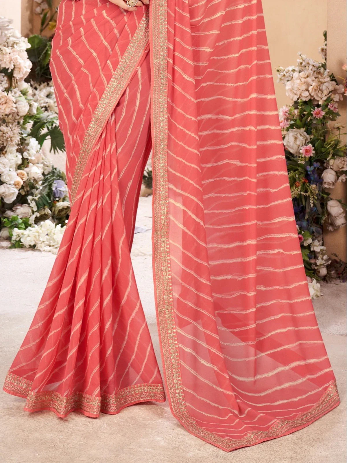 Tarani coral leheriya poly georgette saree intricate border and fabric close-up