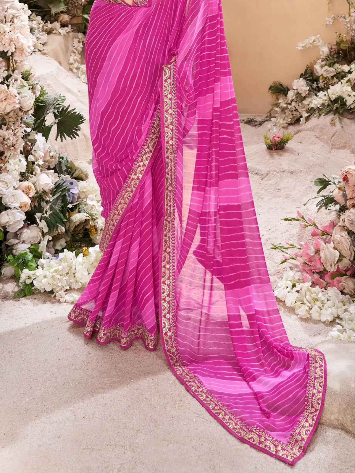Tarani pink leheriya saree pallu view with golden border detailing