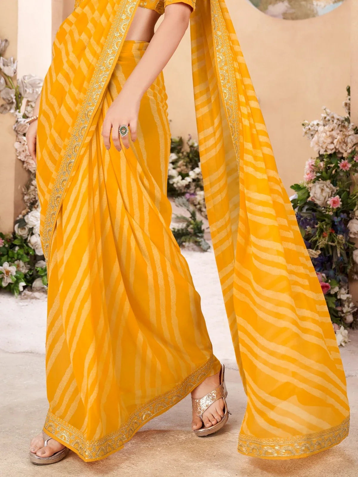 Tarani yellow leheriya pattern saree fabric close-up view from Tarani