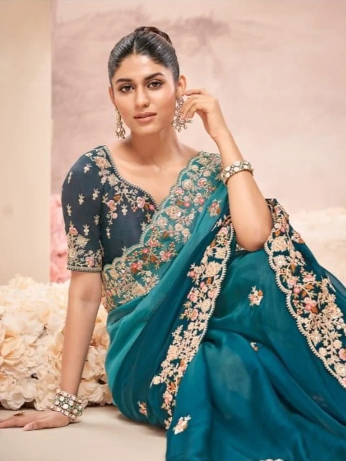 Tarani green saree upper body view with intricately worked designer blouse and matching jewelry