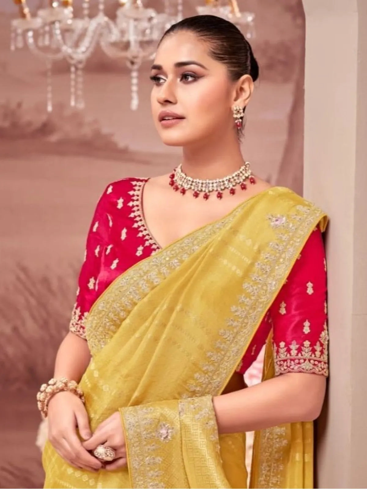 Tarani premium saree close up of red heavy blouse and yellow weave for elegant occasions