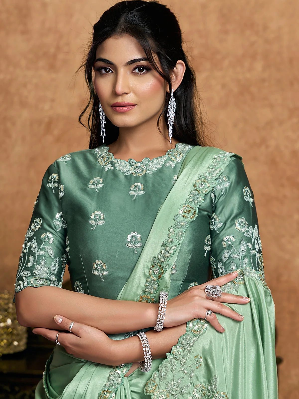 Tarani Durvanka green saree upper body view with embroidered satin silk blouse and handwork border