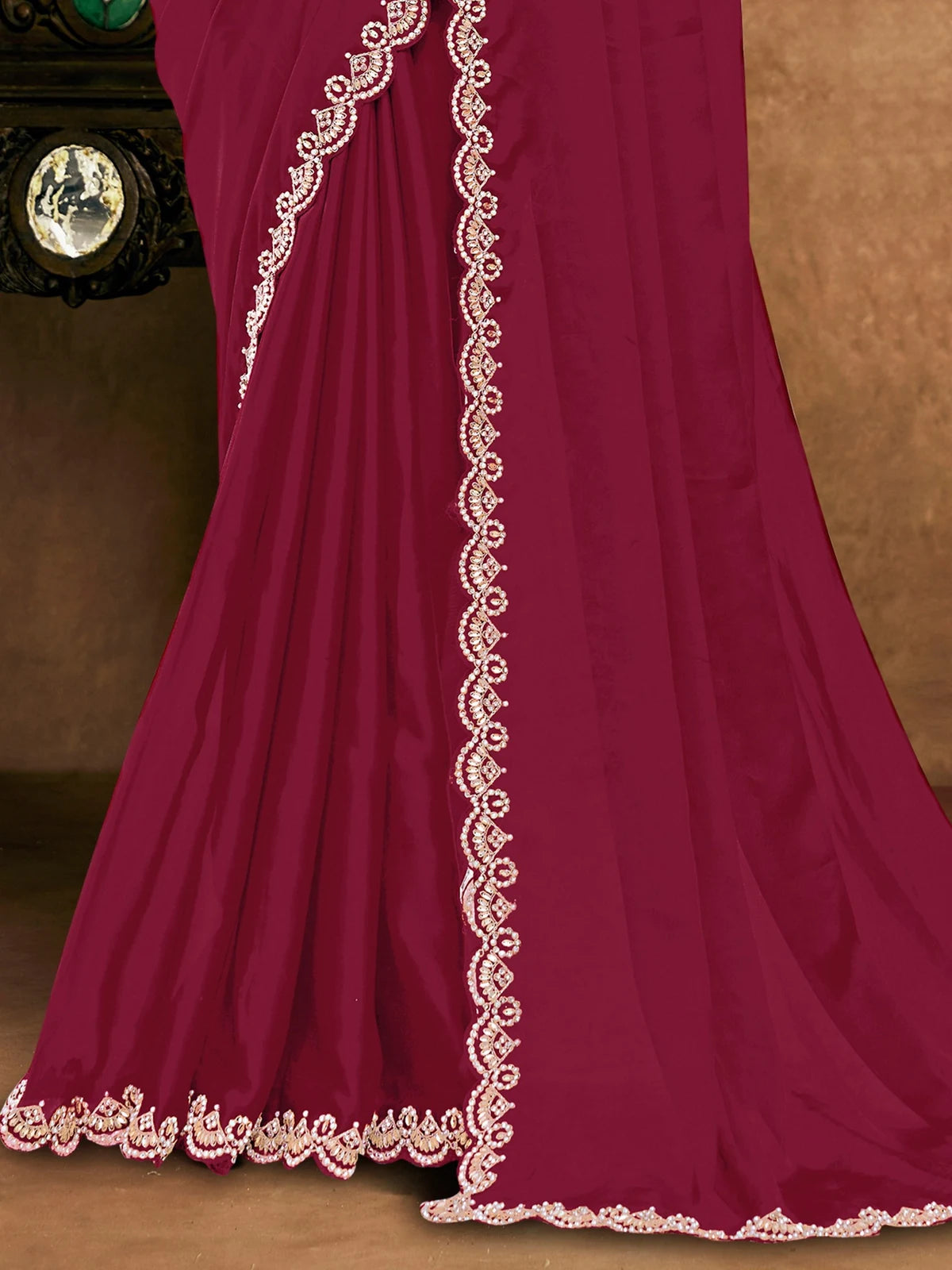 Tarani Mitasha pallu and border view with intricate Moti handwork on maroon saree