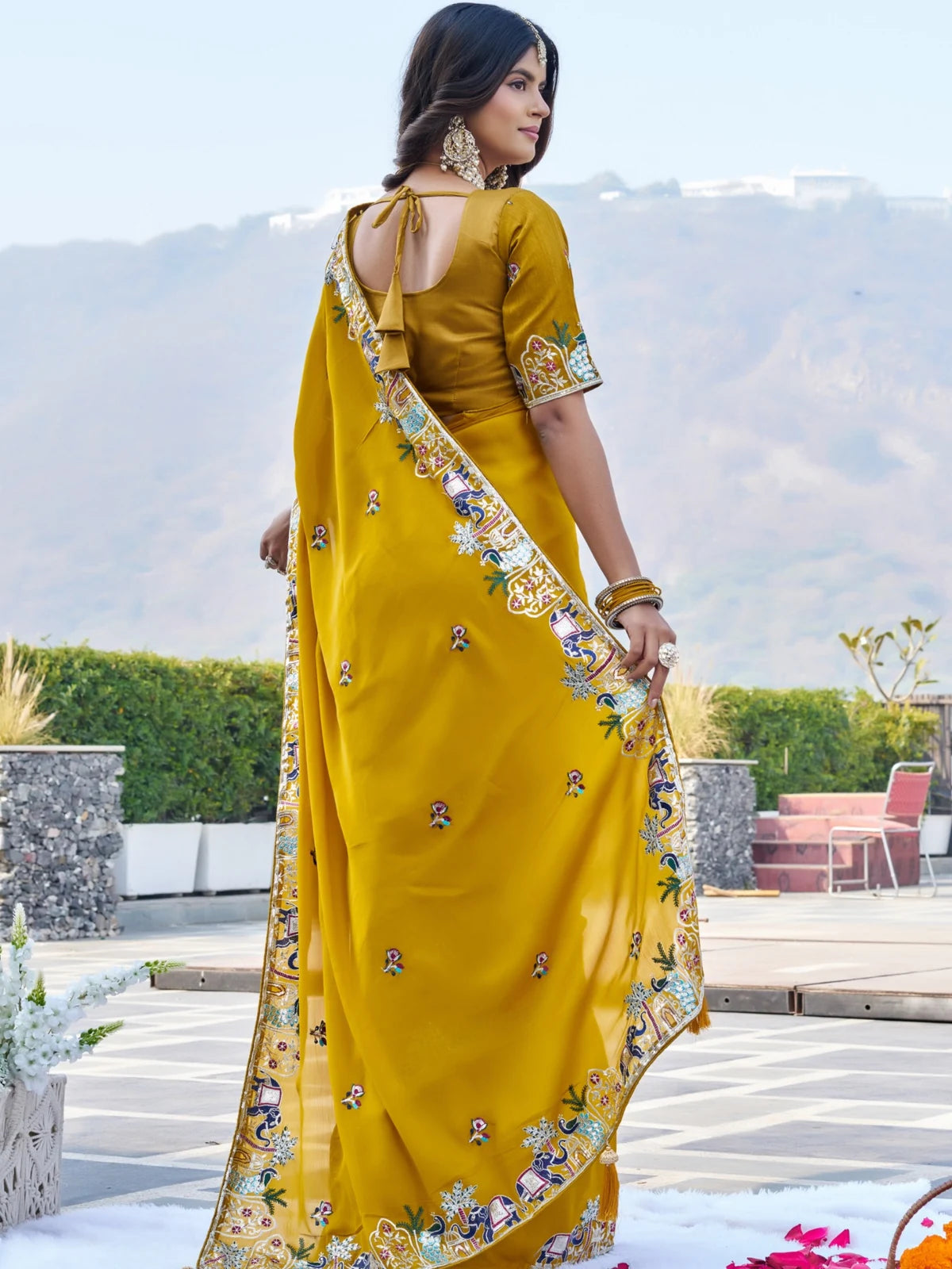 Tarani mustard satin chiffon saree back view showcasing embroidered blouse and detailed border