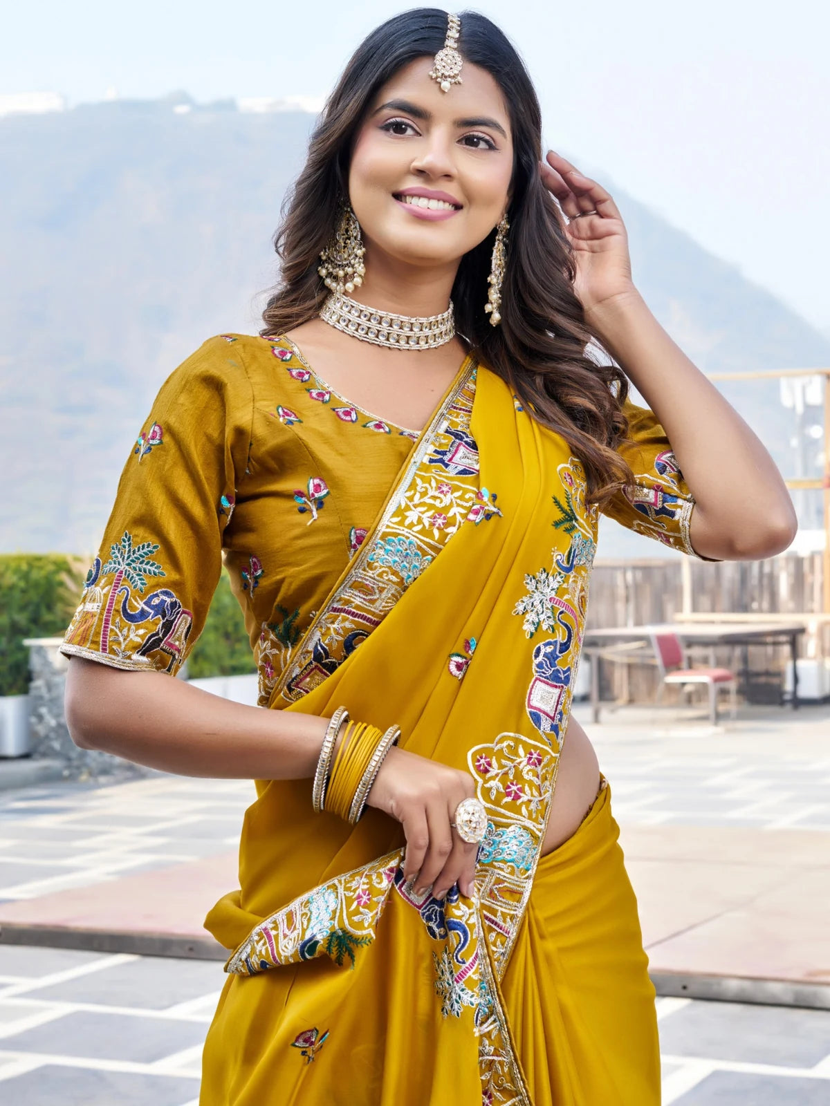 Tarani mustard satin chiffon saree upper body view with heavy embroidery blouse and designer border