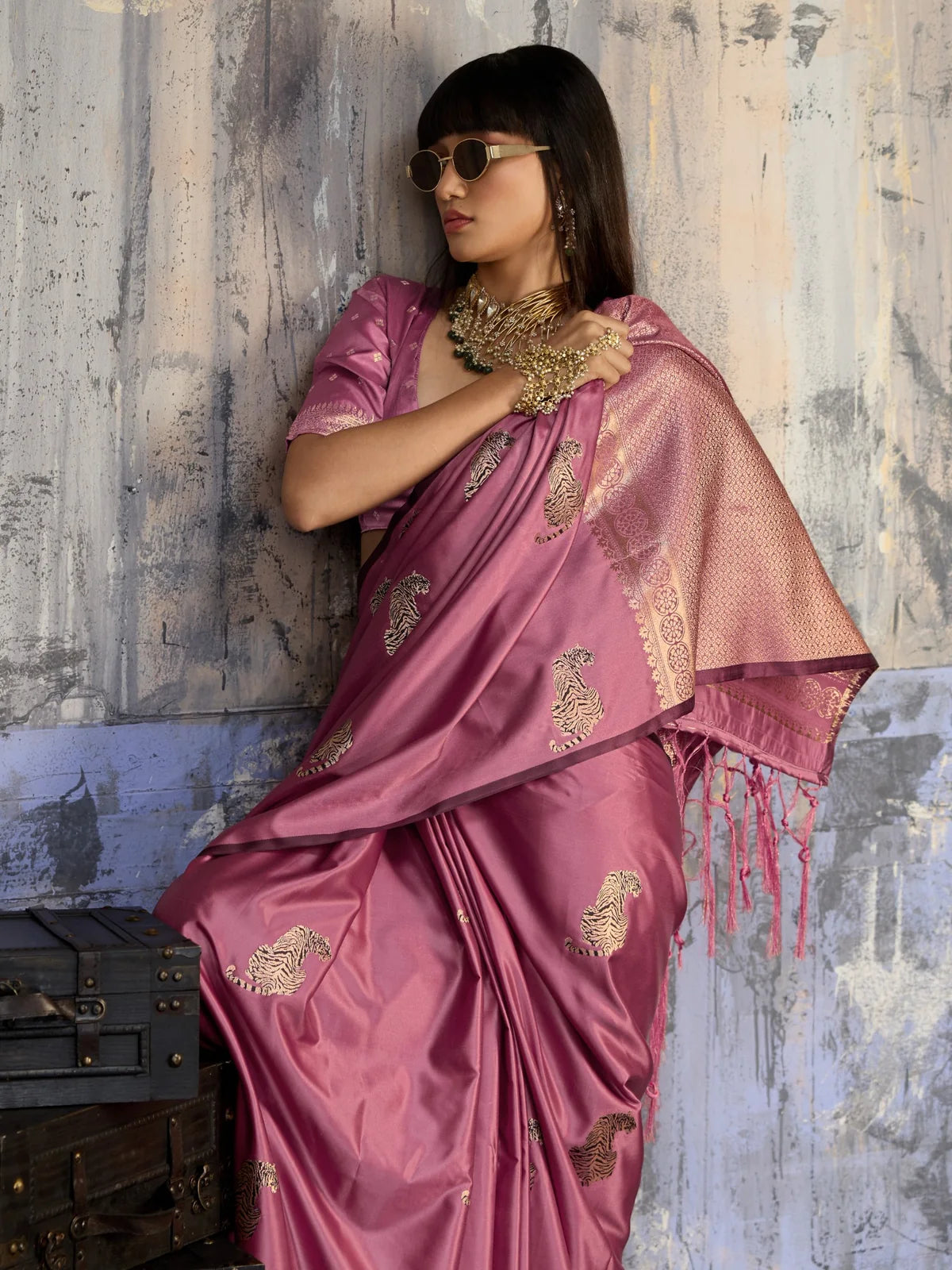 Tarani pink satin handloom saree pallu view with detailed woven border and tassels