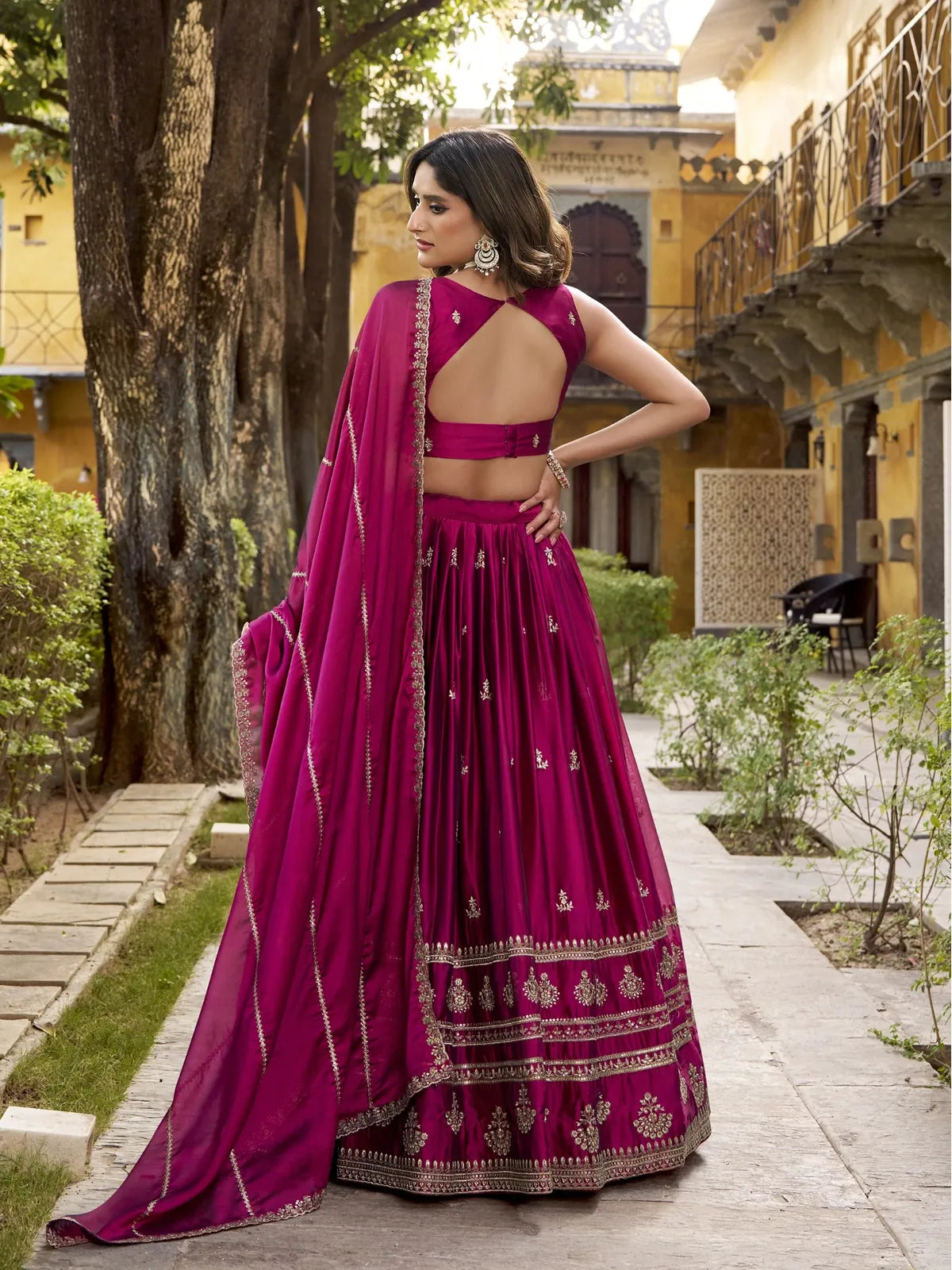 Tarani magenta lehenga close-up showing blouse and dupatta border embroidery detailing
