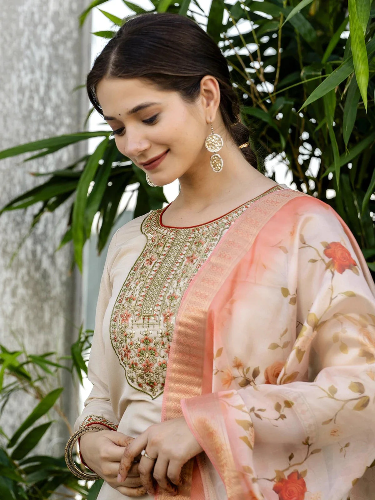 Tarani closeup of beige rayon dress embroidery and floral dupatta in soft peach tones