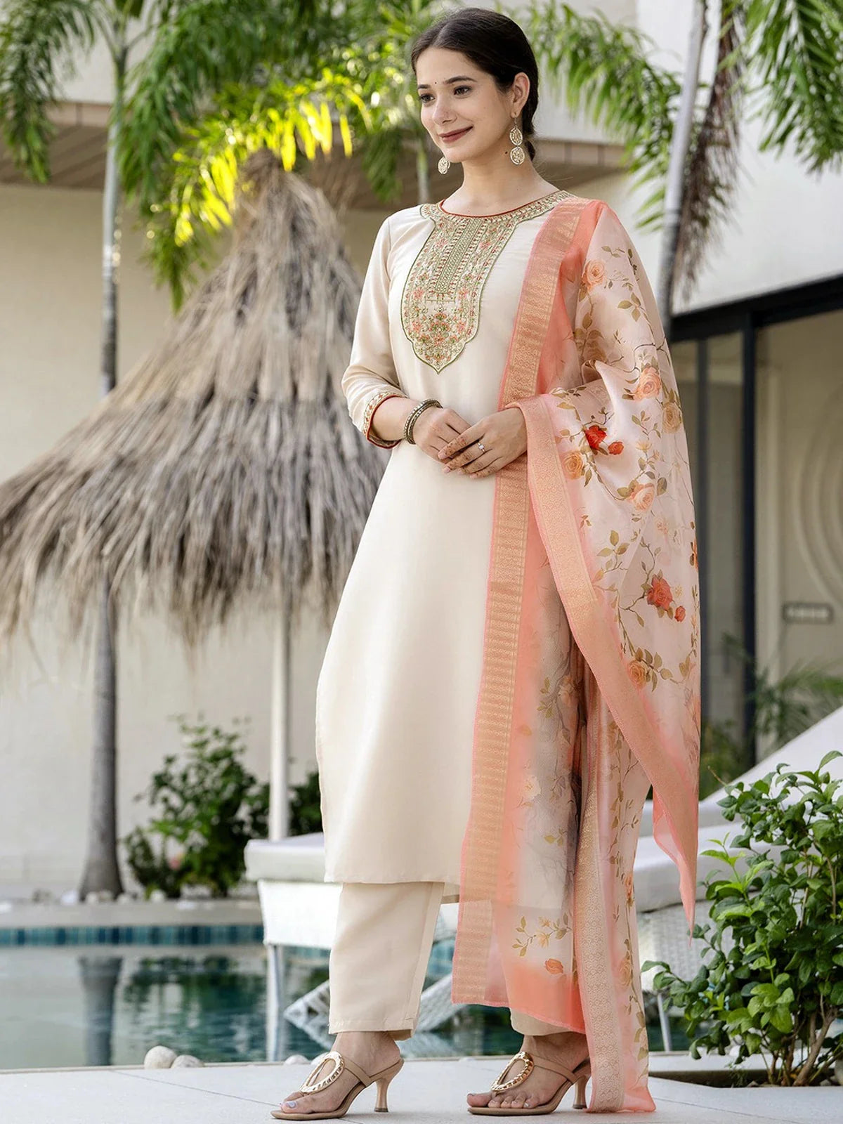 Tarani front pose of beige embroidered rayon dress with peach floral dupatta