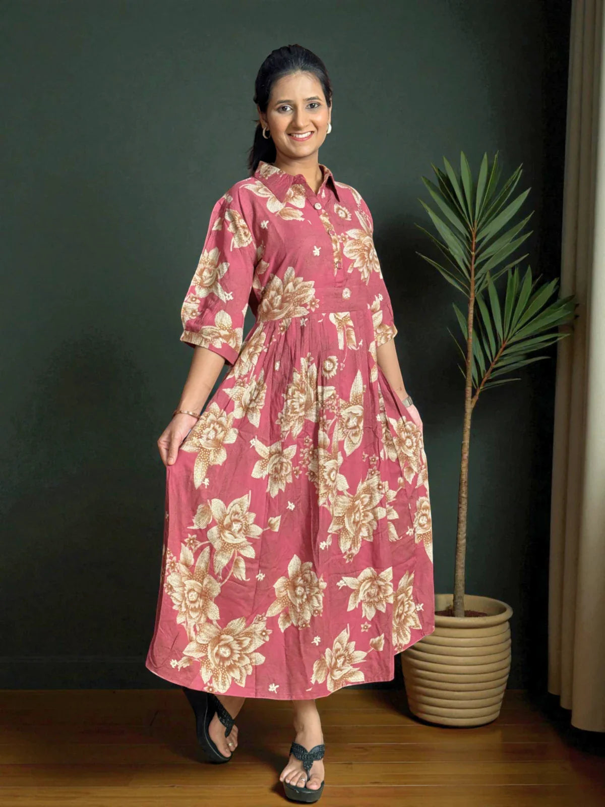 Tarani maroon midi dress in rayon fabric with floral prints shown in front pose view