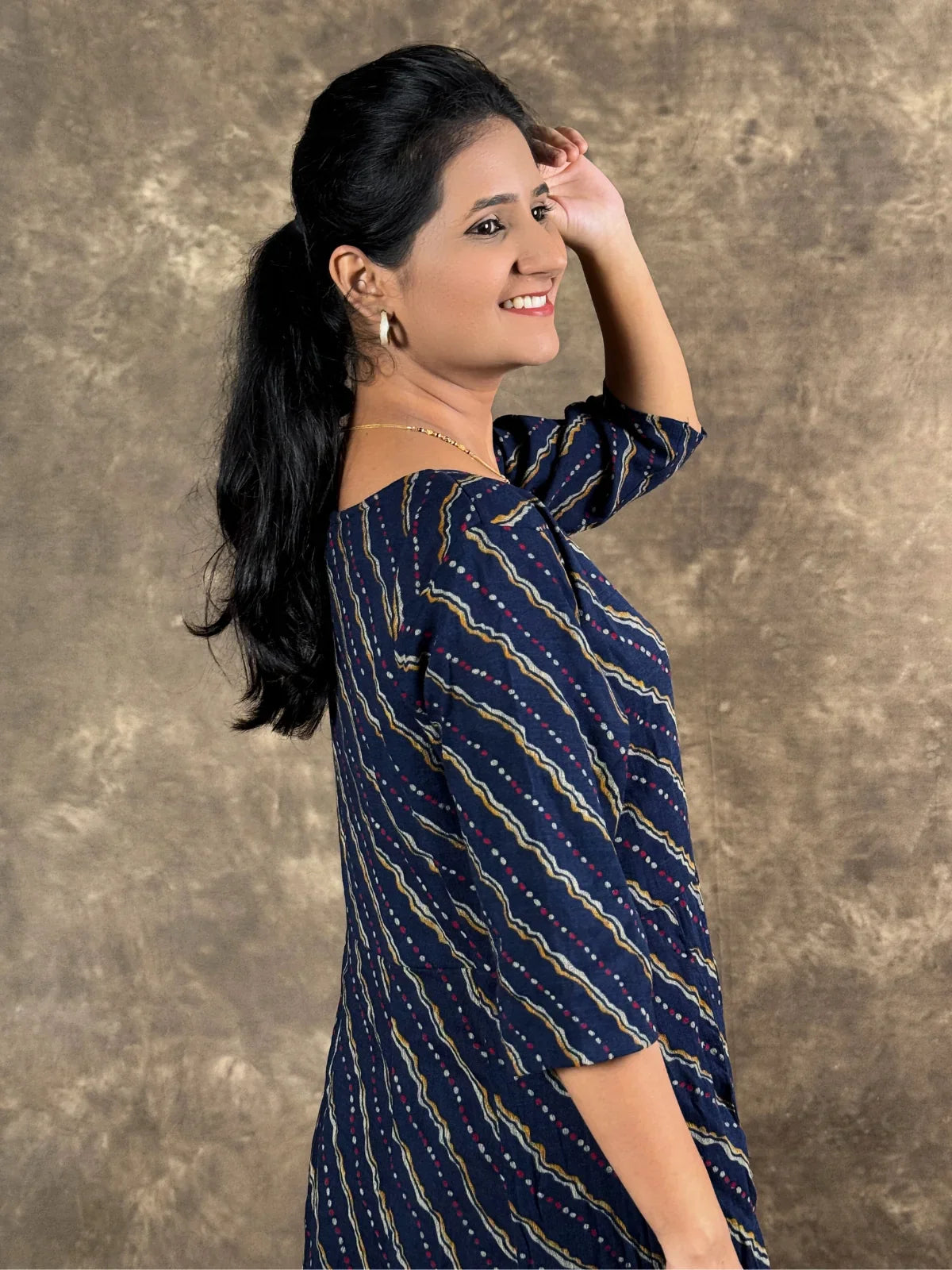 Tarani navy blue rayon midi dress side view with elegant fit and flare design