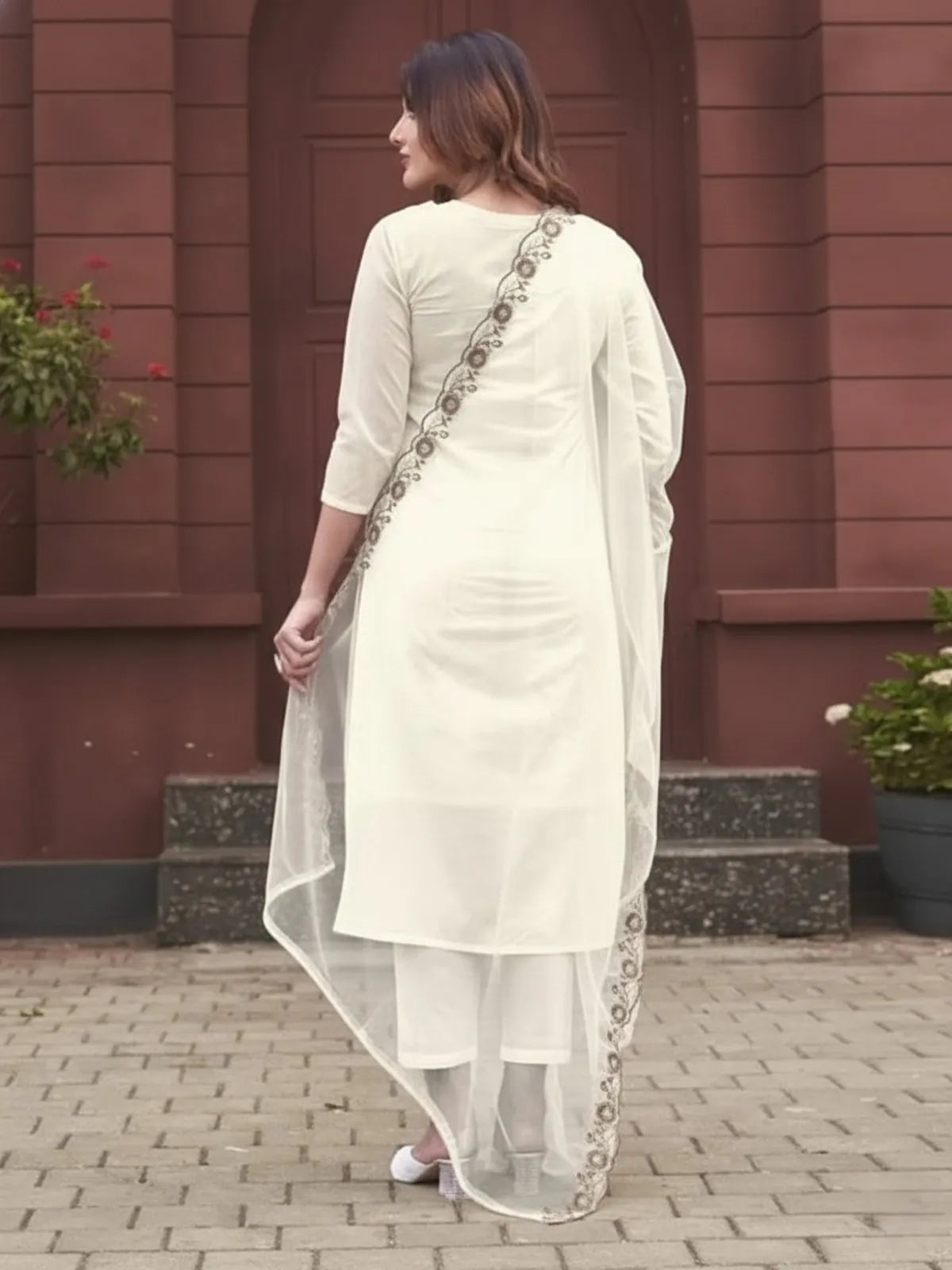 Back view of off white rayon embroidered kurti pant set with dupatta by Tarani