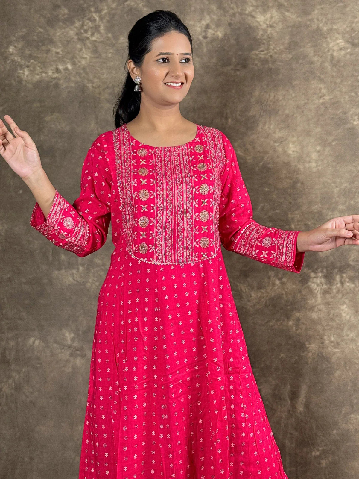 Tarani pink rayon anarkali dress front view highlighting flare and design