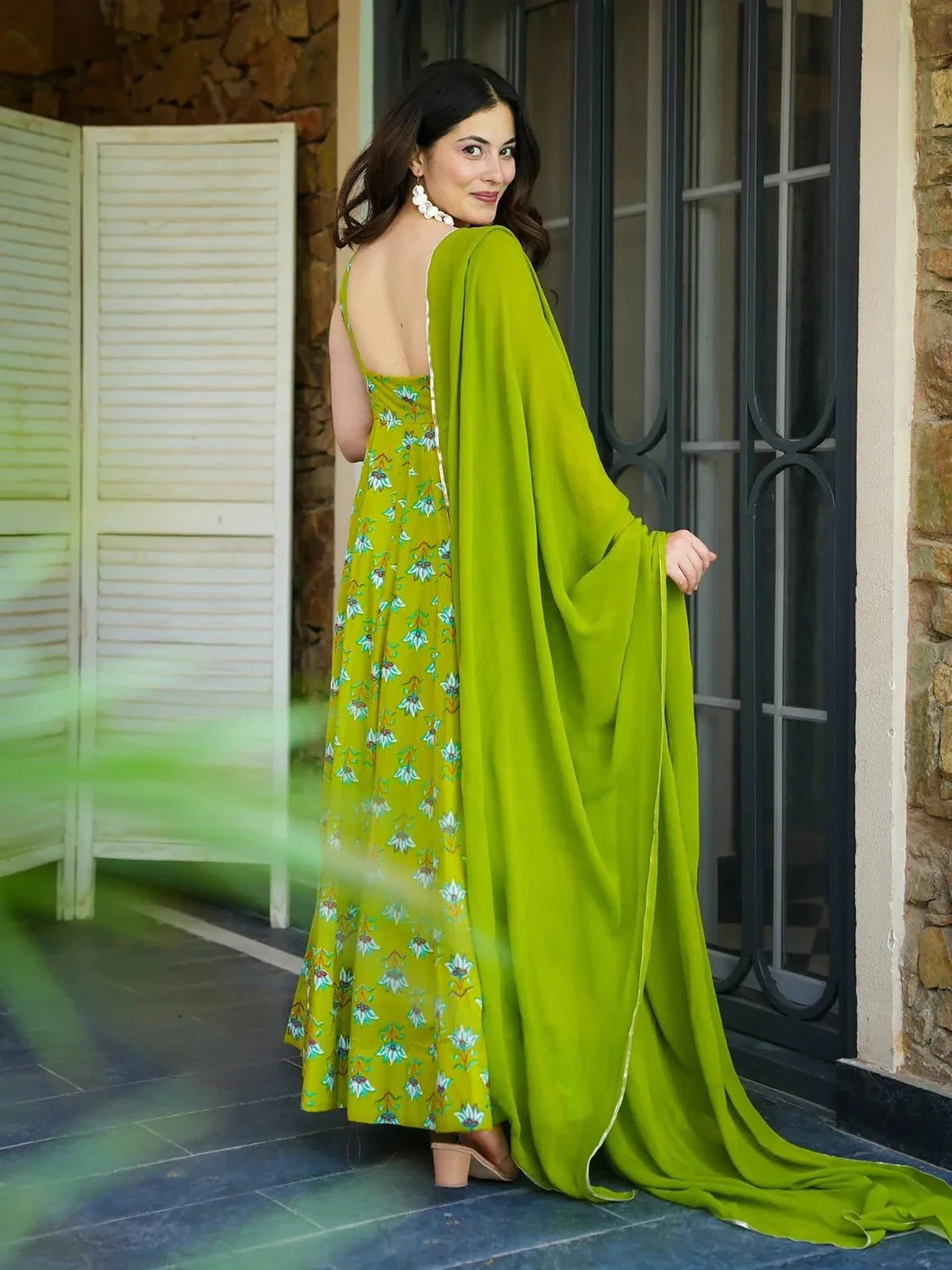 Tarani green rayon gown back view highlighting clean back design and graceful fall