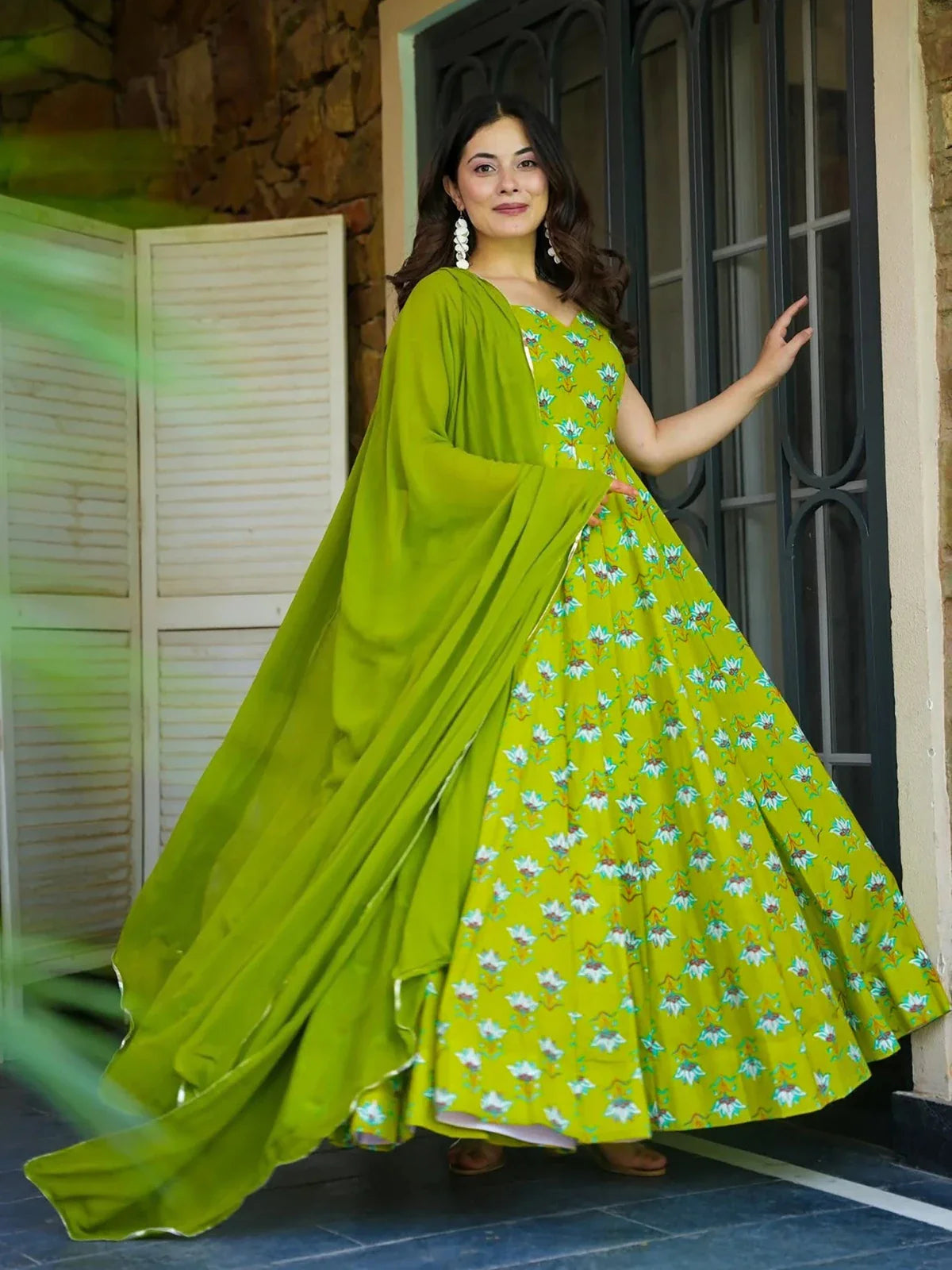 Tarani green festive rayon gown front view with flowing flare and modern ethnic style