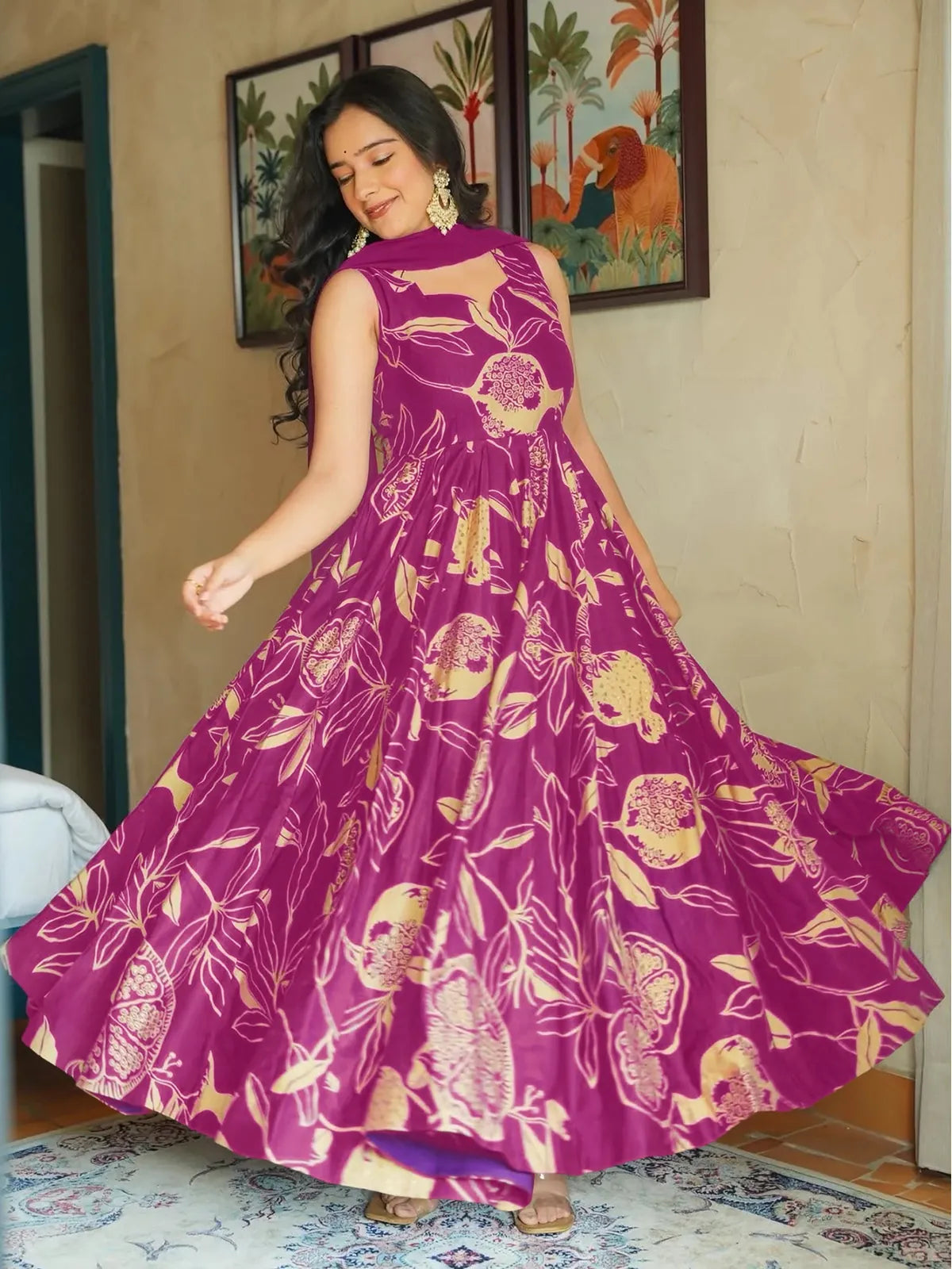 Tarani magenta full-length rayon gown with festive print and stylish flare