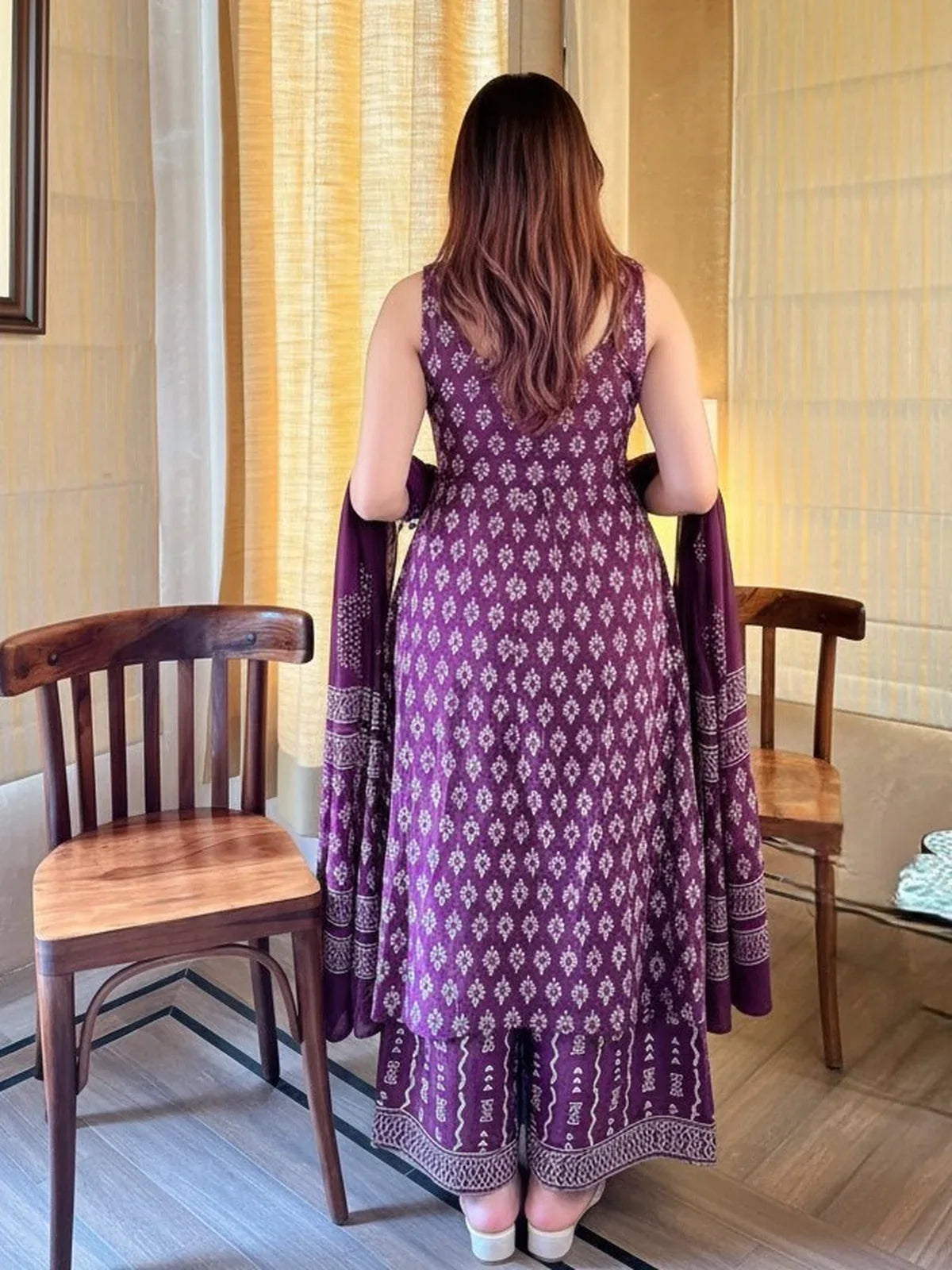Tarani rayon slub dress back view highlighting full printed flare and dupatta fall in maroon tone