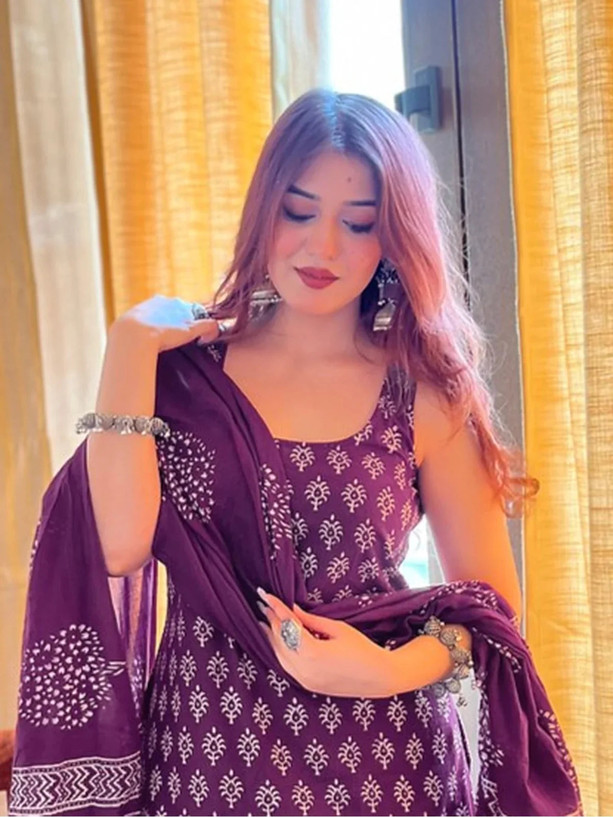 Tarani maroon rayon slub dress upper-body closeup with elegant traditional print and silver accessories