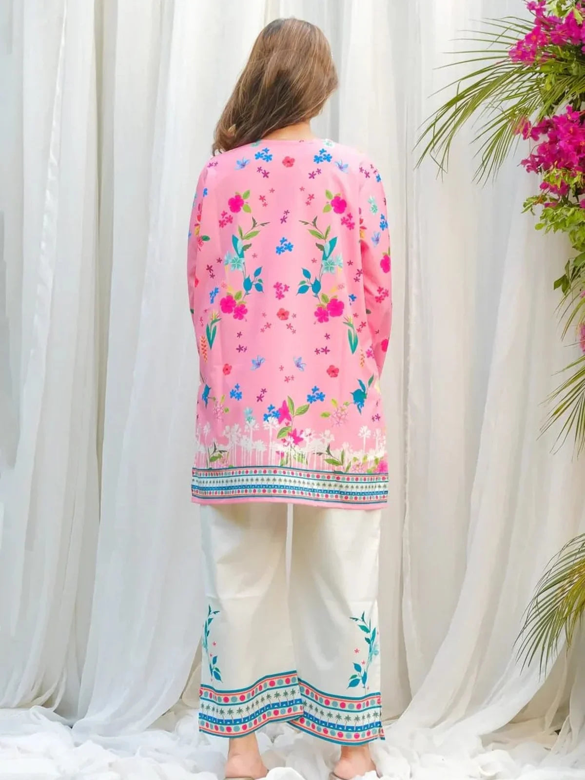 Tarani pink printed reyon dress back view showing floral layout and elegant length