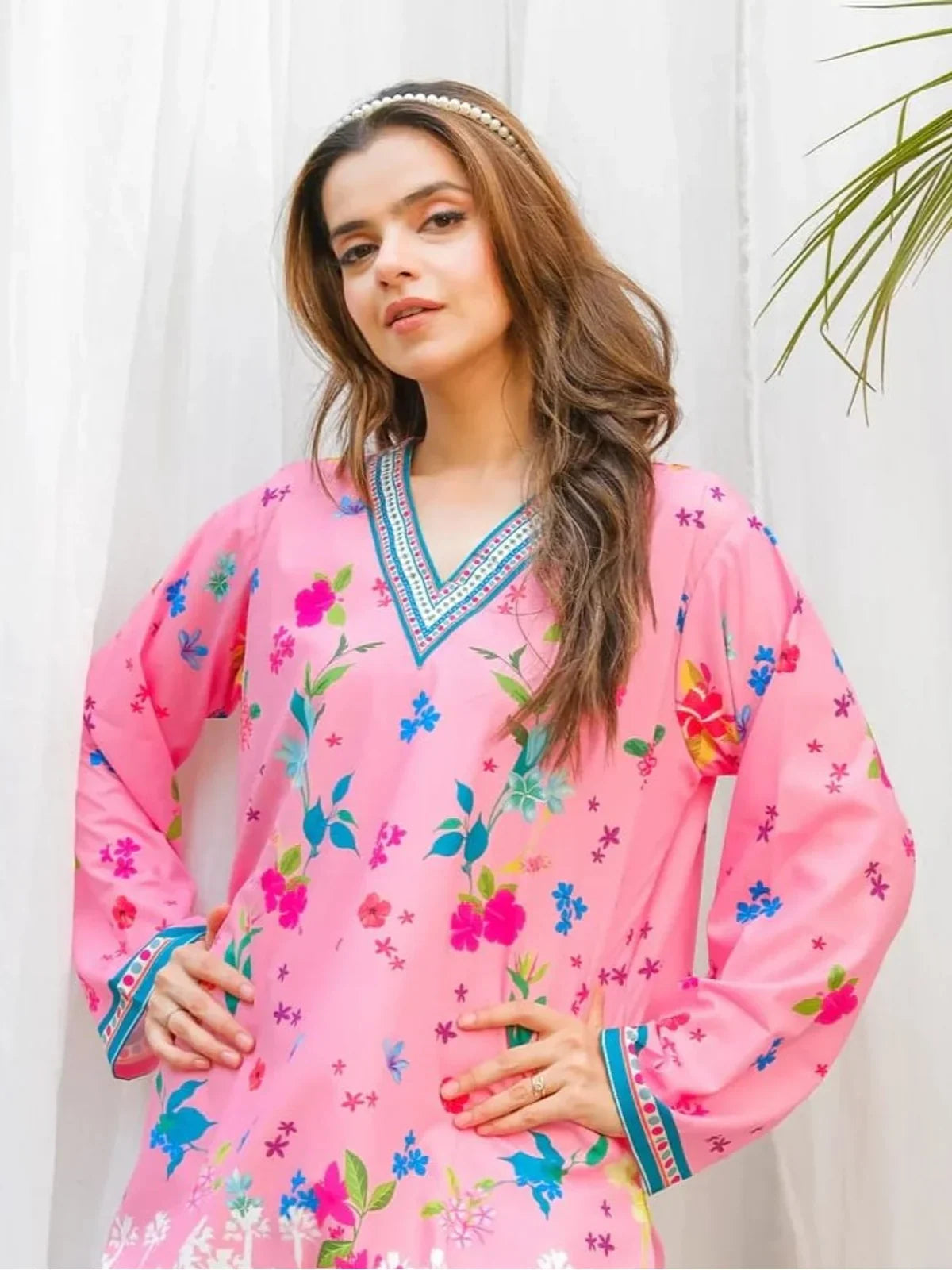 Tarani pink reyon dress with floral motifs and full sleeves upper body closeup