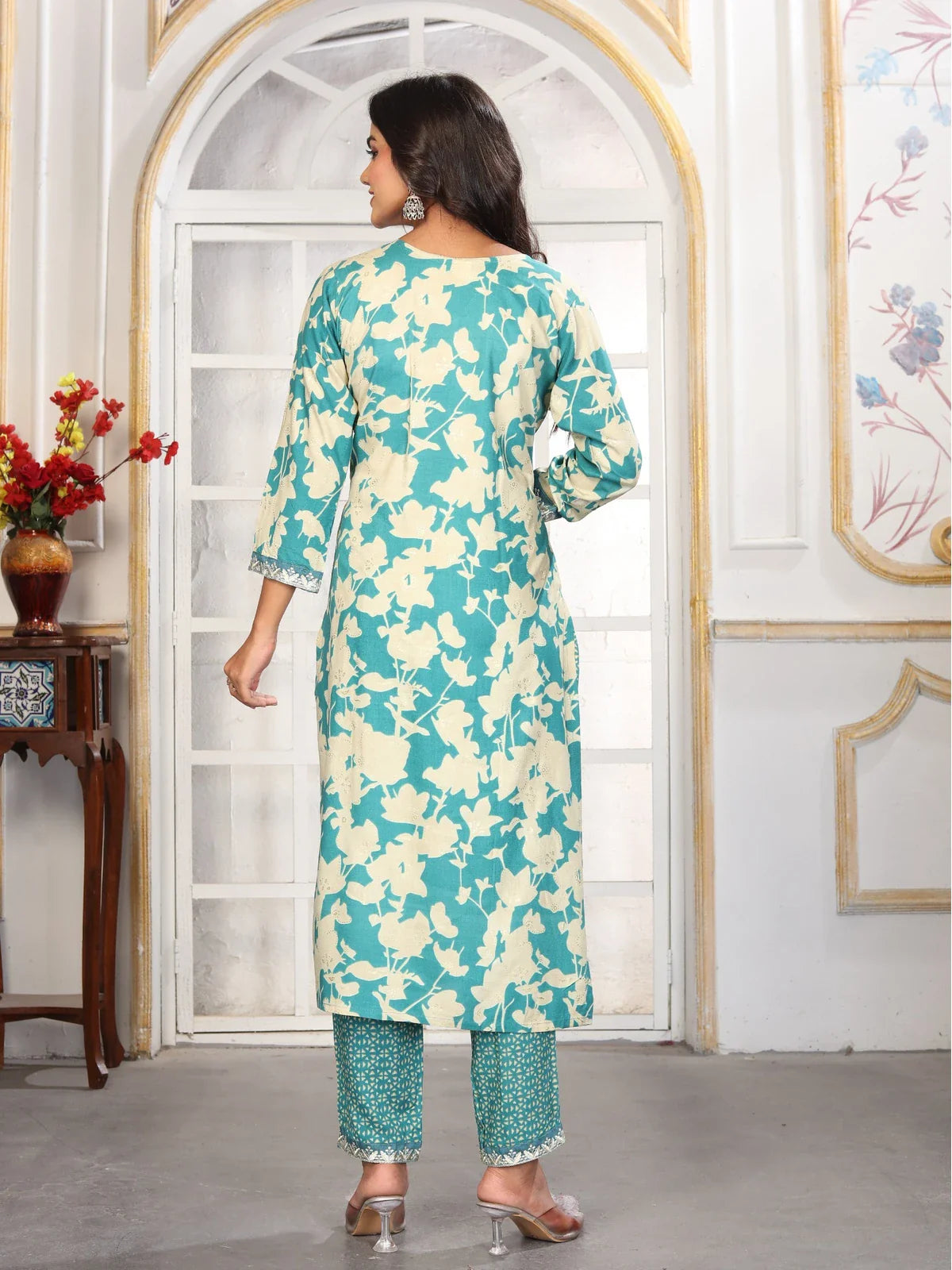 Tarani green rayon dress back view highlighting floral print and dupatta flow