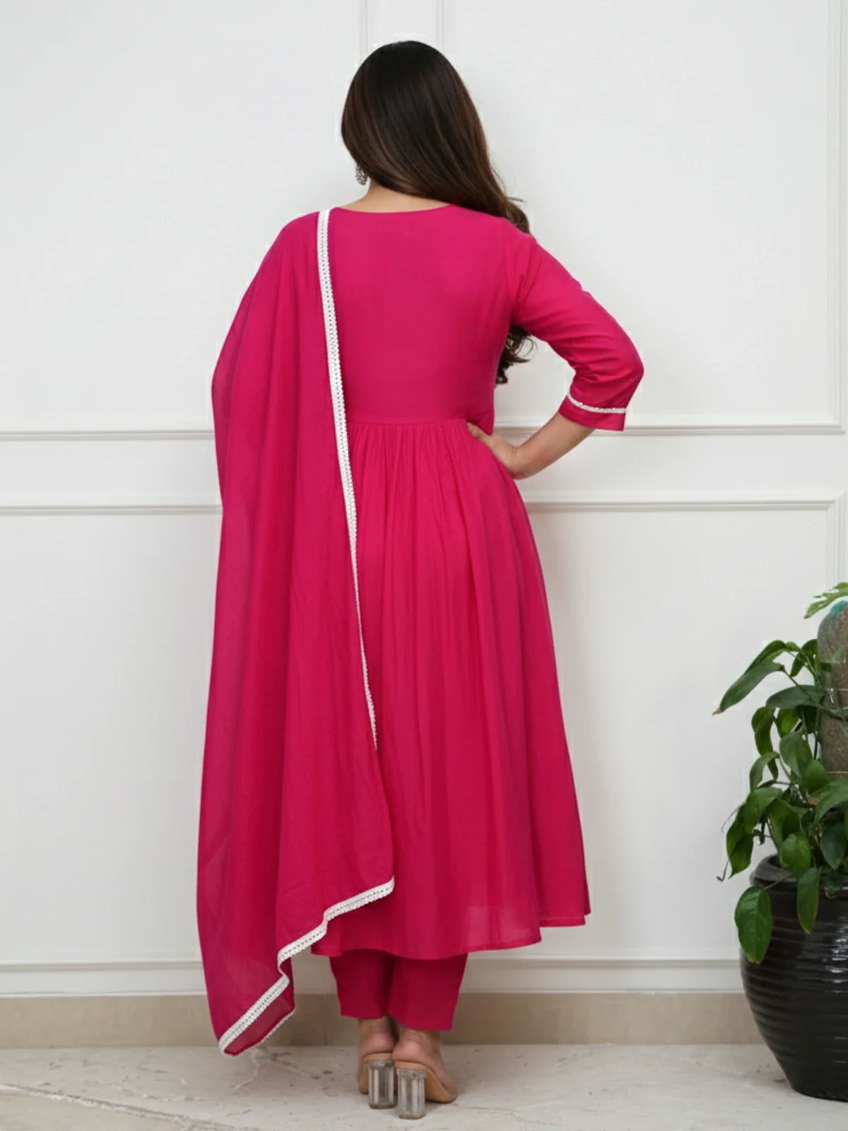 Back view of Tarani pink Roman festive dress with printed dupatta and pleated back design