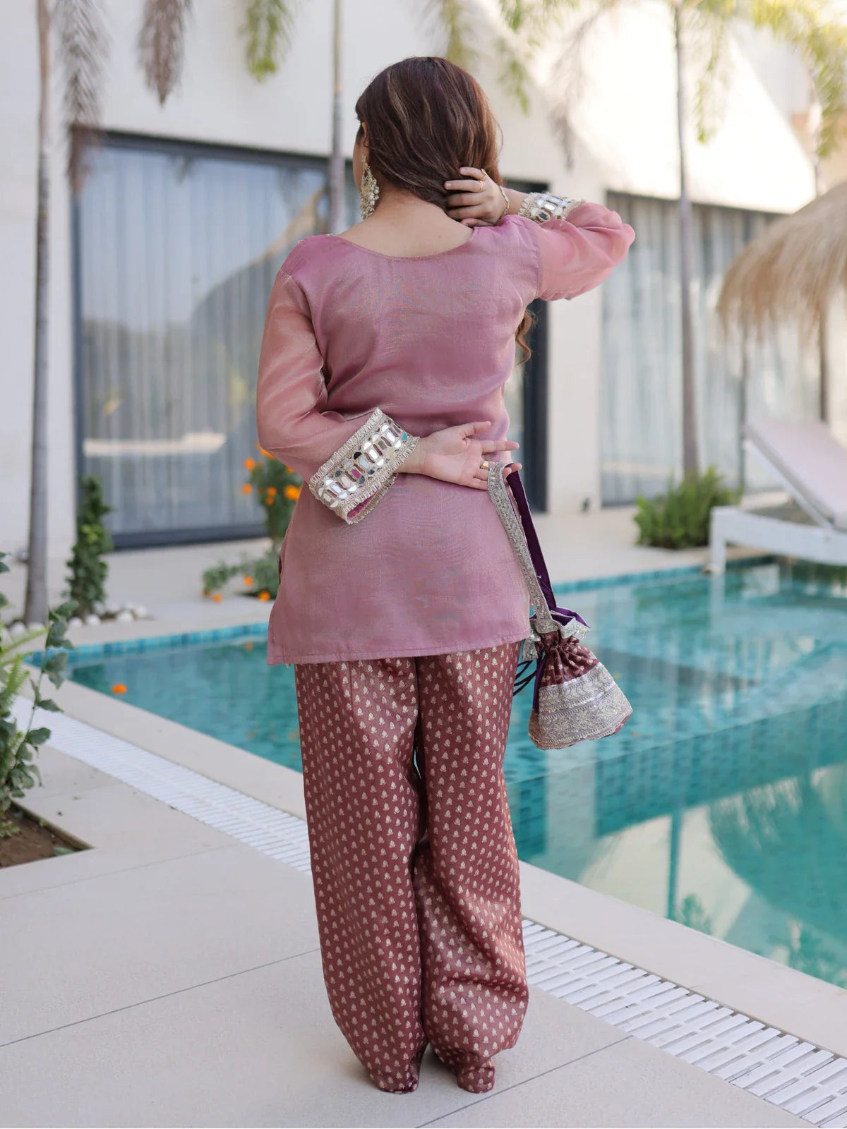 Tarani designer pink gown back side showing lacework sleeves and matching batwa – back view