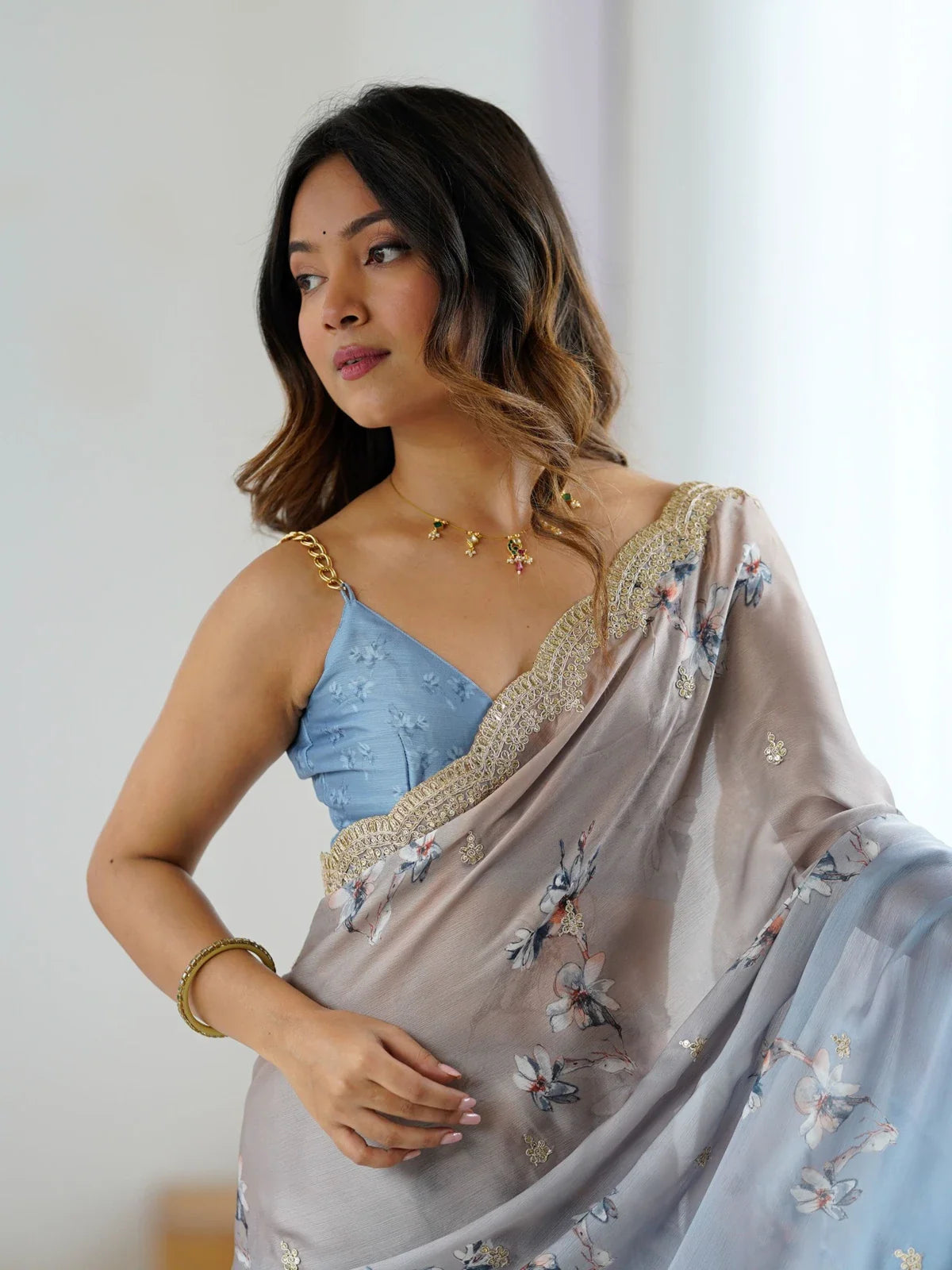 Tarani blue satin chiffon saree upper body view showing blouse and embroidery