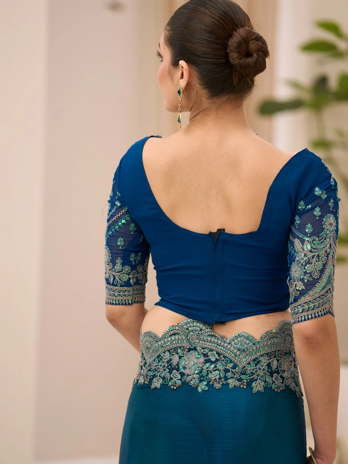 Tarani Agnya back view of embroidered Banglori blouse with rama green designer saree